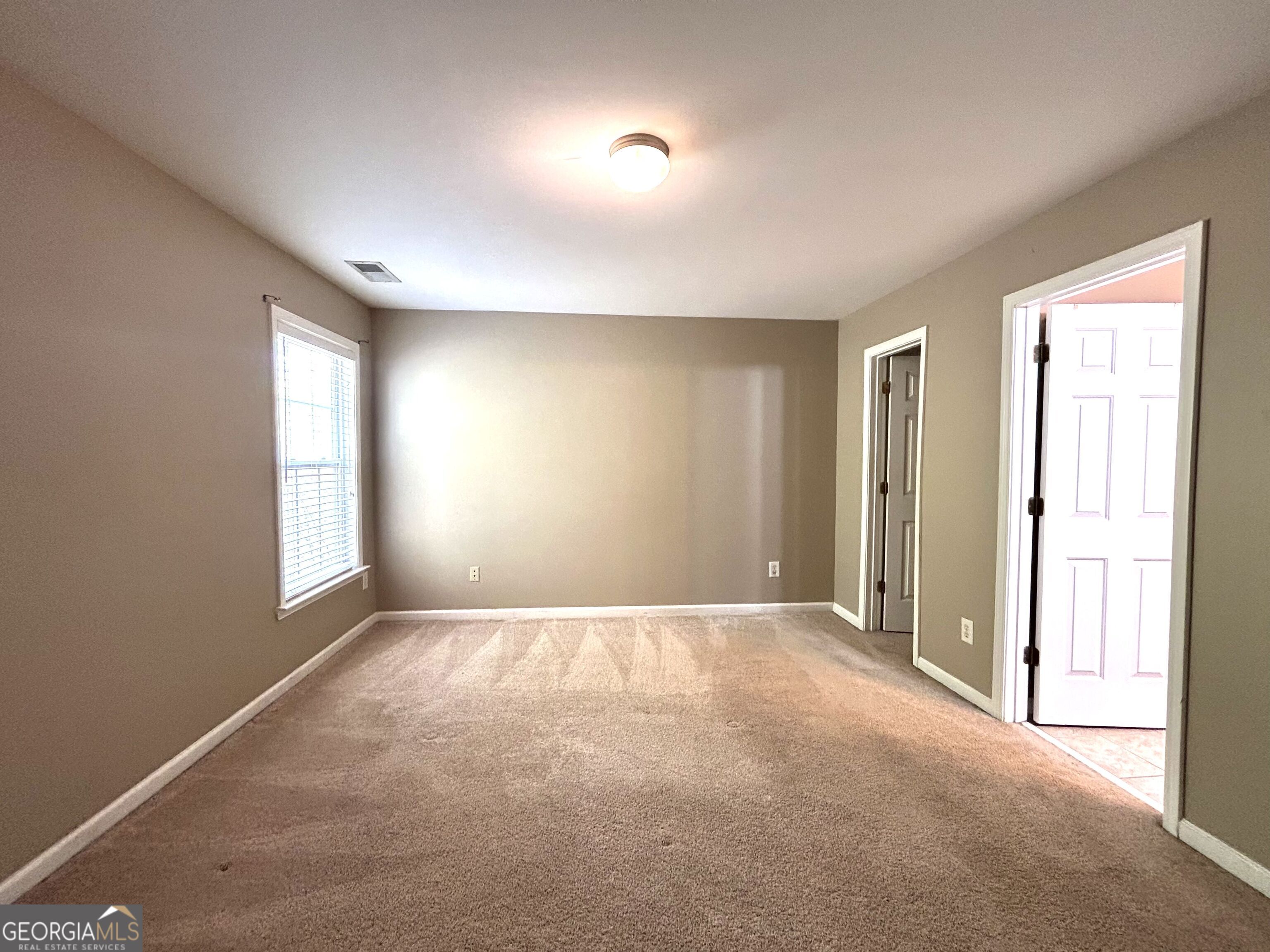 7613 Cedar Grove Court Fairburn, GA 30213 - Photo 49 of 61 a view of an empty room with a window