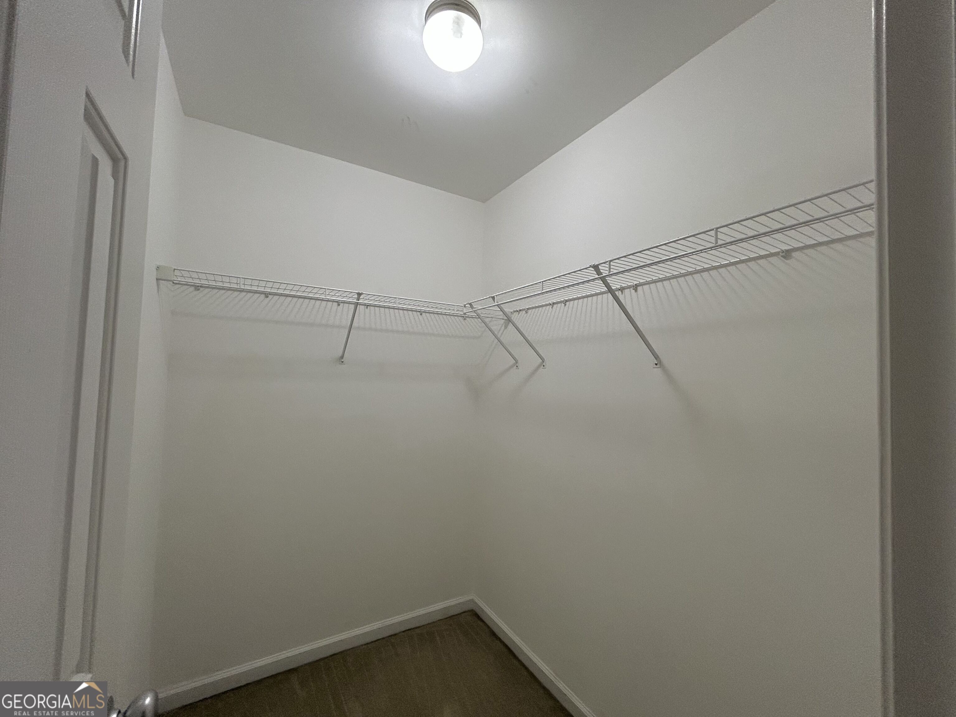 7613 Cedar Grove Court Fairburn, GA 30213 - Photo 51 of 61 a view of a room with racks on the wall