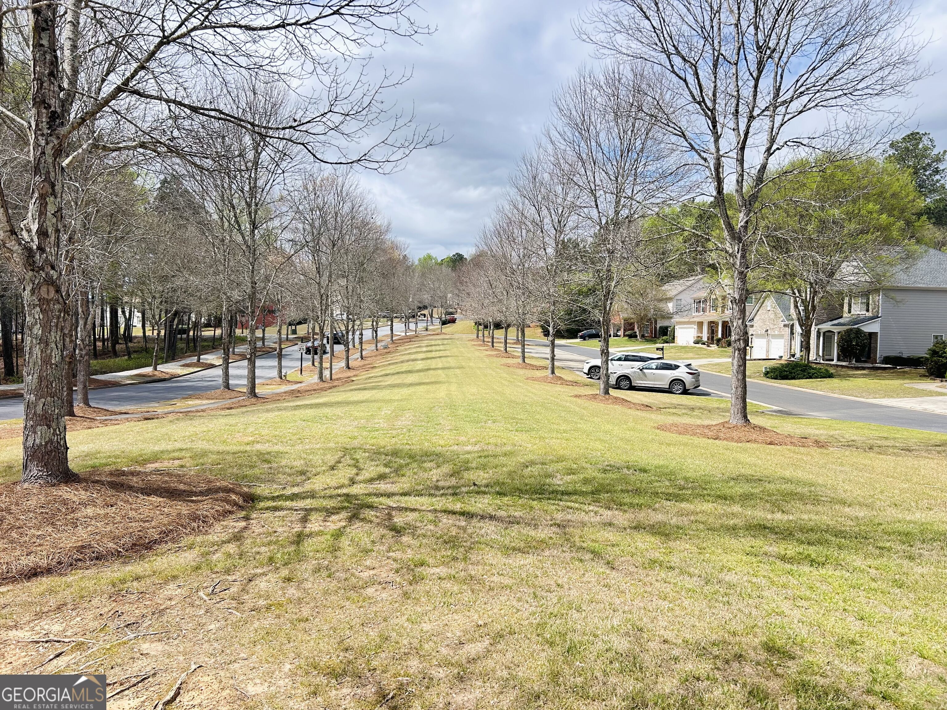 7613 Cedar Grove Court Fairburn, GA 30213 - Photo 8 of 61 a swimming pool with outdoor seating and trees