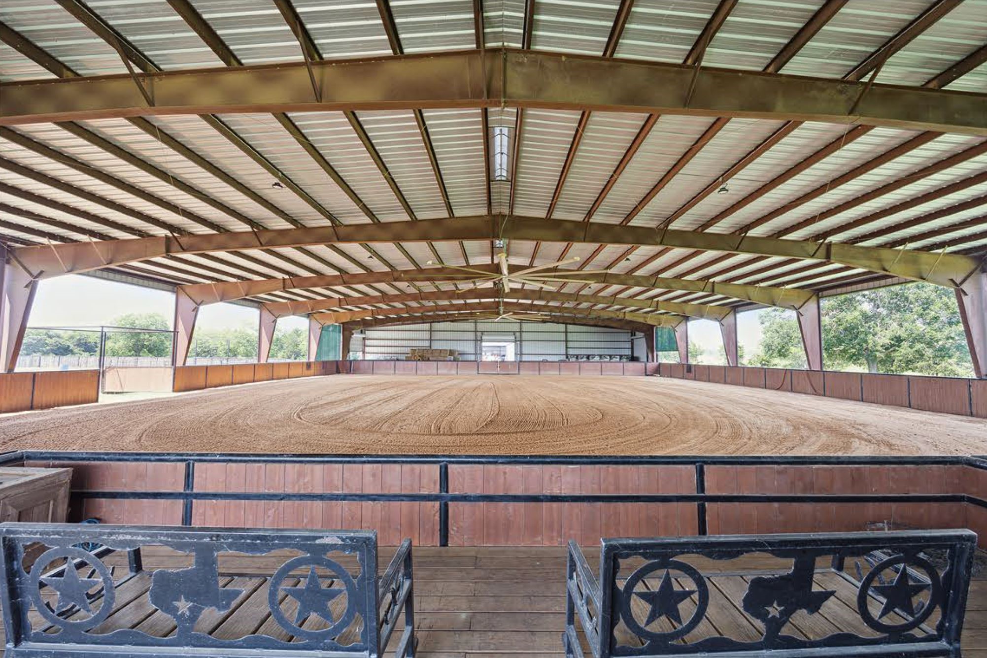 1325 Stalmach Road New Ulm, TX 78950 - Photo 16 of 50 Indoor arena viewing deck 12'x25'; "Big Ass Fan"; 2 roll-up doors w/hay storage