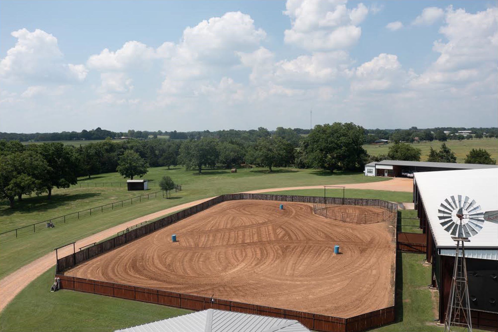 1325 Stalmach Road New Ulm, TX 78950 - Photo 19 of 50 Outdoor arena 107'x156'. Pipe and native cedar plank fencing w/3'x20' viewing deck.