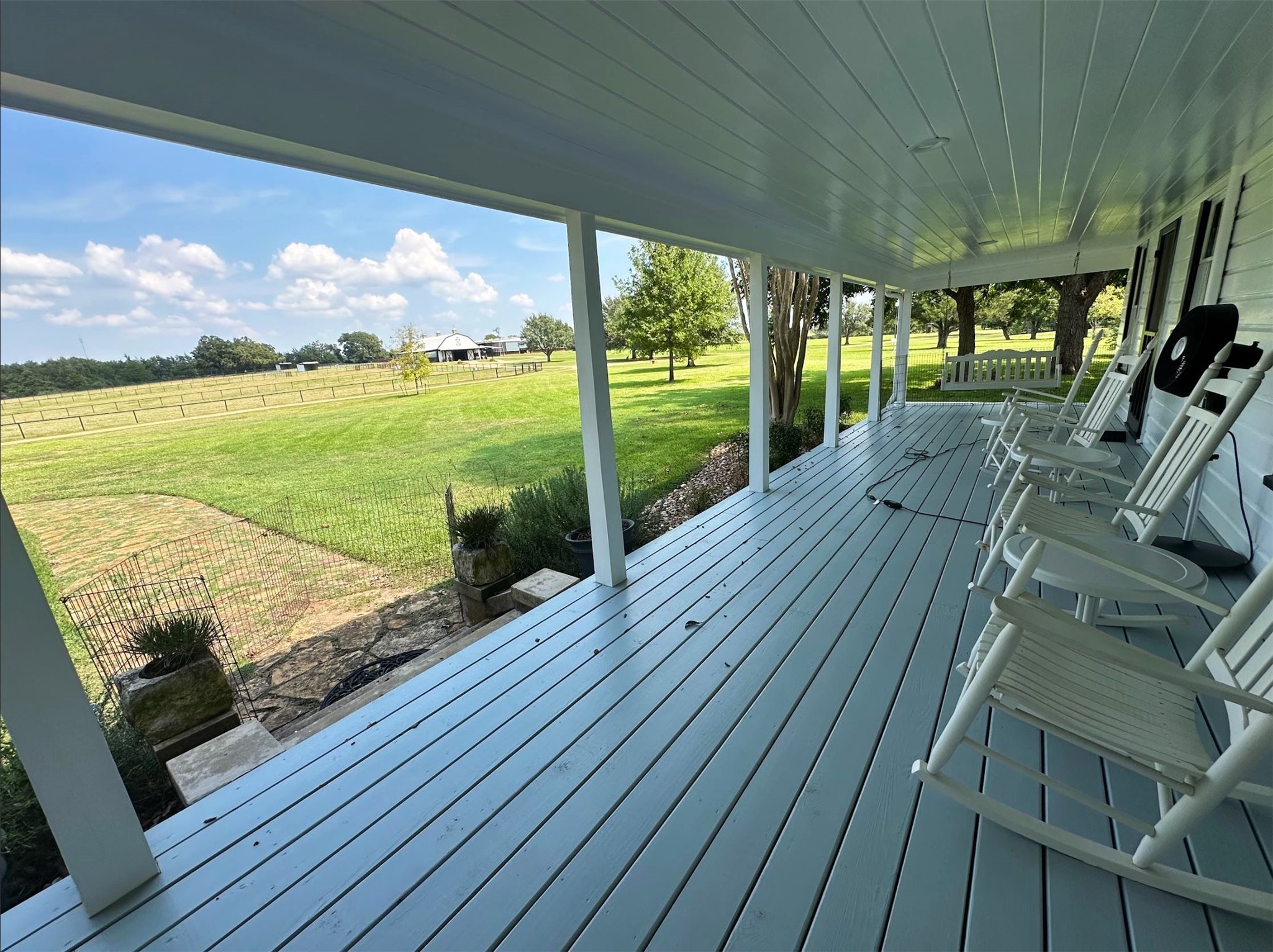 1325 Stalmach Road New Ulm, TX 78950 - Photo 32 of 50 Front porch overlooking horse paddocks and native pastures.