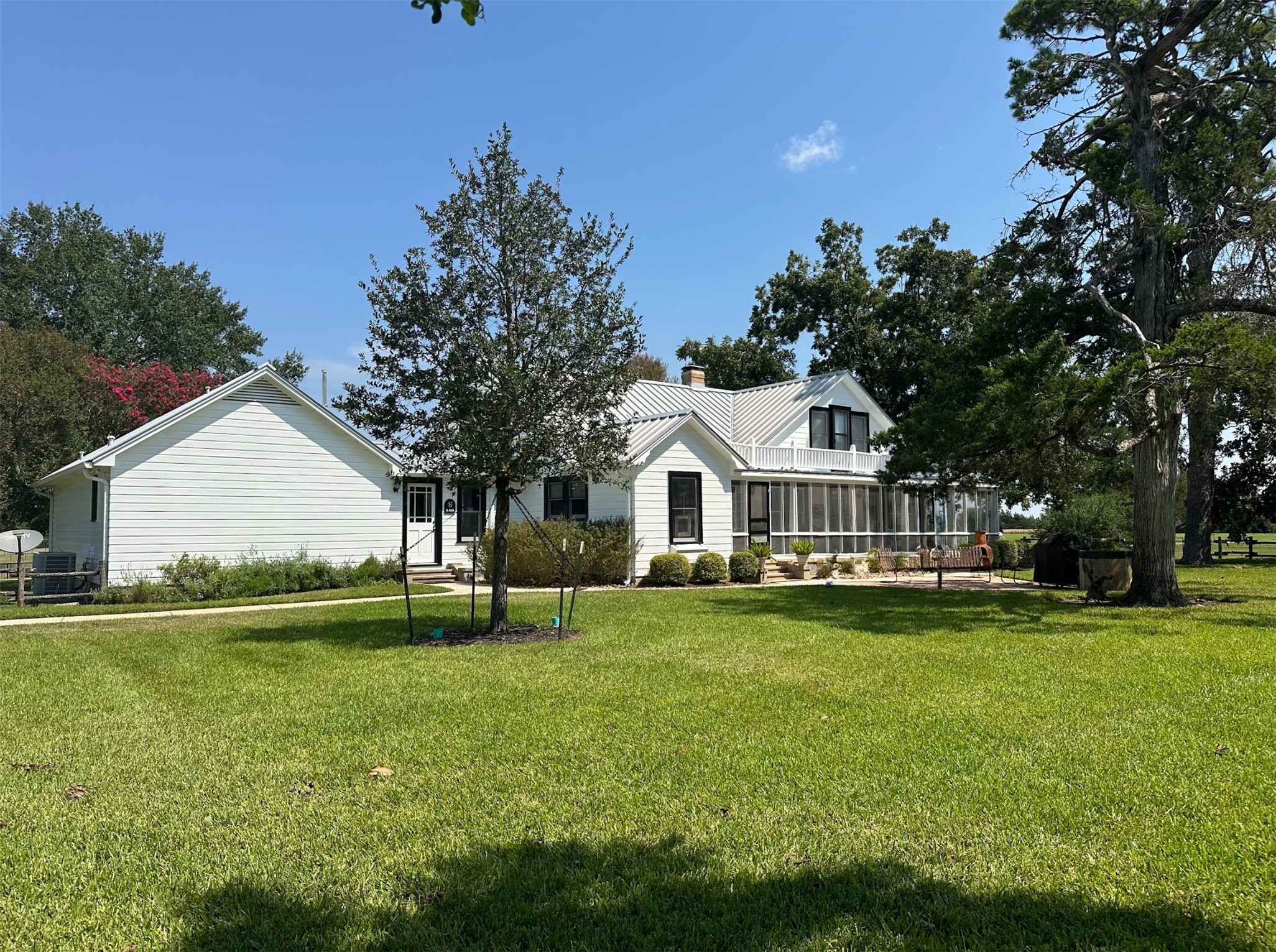 1325 Stalmach Road New Ulm, TX 78950 - Photo 35 of 50 Back corner view of the sprawling backyard dotted with live oak trees.