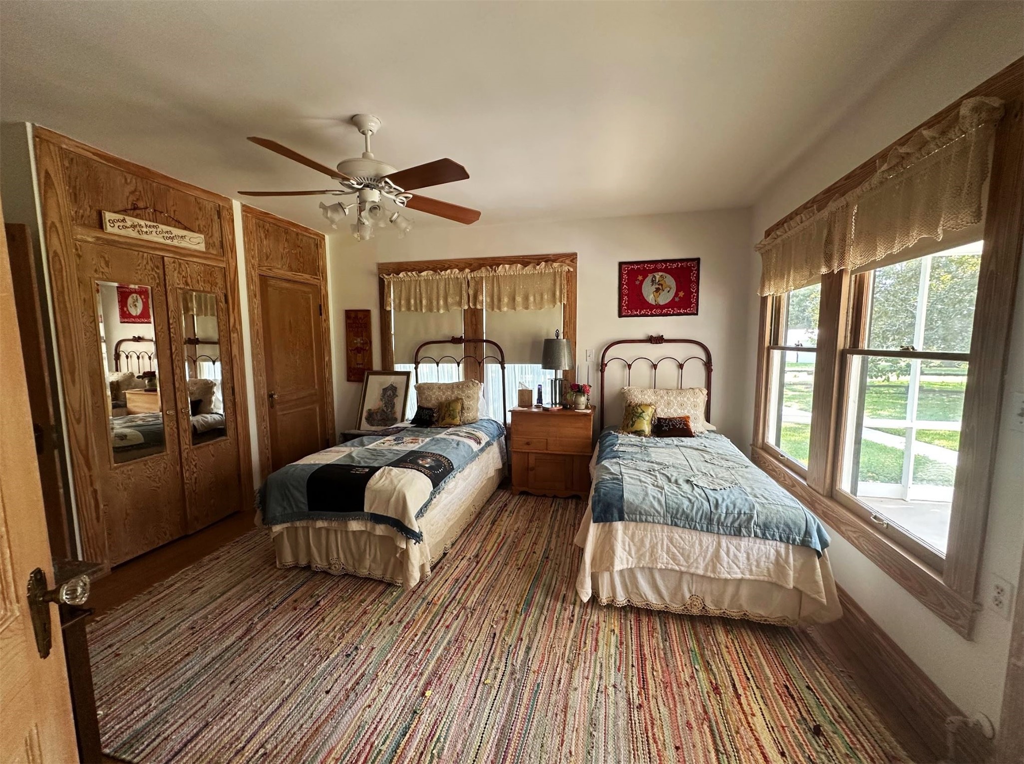 1325 Stalmach Road New Ulm, TX 78950 - Photo 40 of 50 Guest bedroom with original wood floors, large windows and 3 closets.