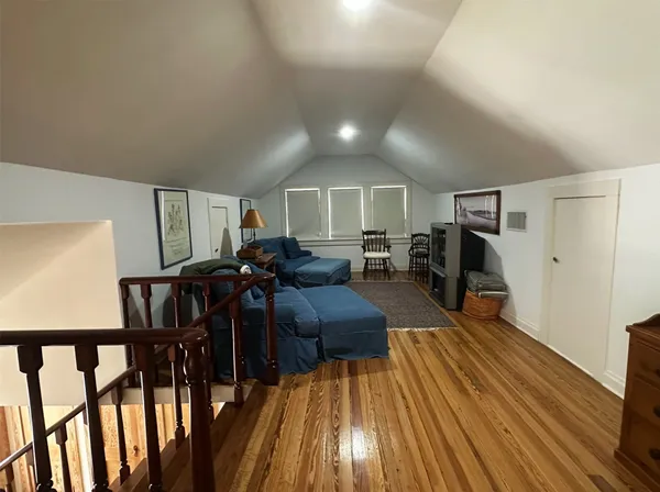 a living room with furniture and a rug