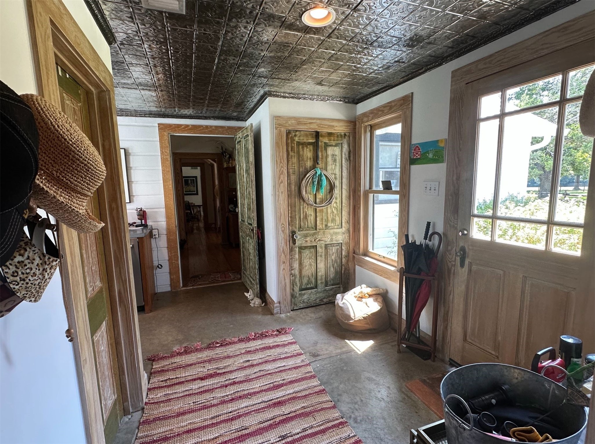 1325 Stalmach Road New Ulm, TX 78950 - Photo 45 of 50 Spacious vestibule connecting master suite; housing the utility room, wine fridge and coat closet.