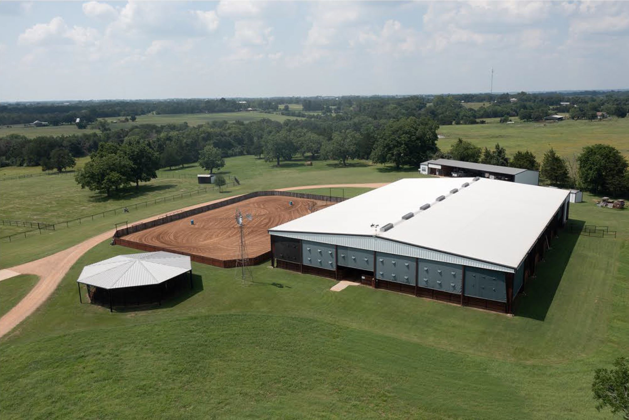 1325 Stalmach Road New Ulm, TX 78950 - Photo 9 of 50 Aerial view of indoor arena, outdoor arena & 4-horse walker