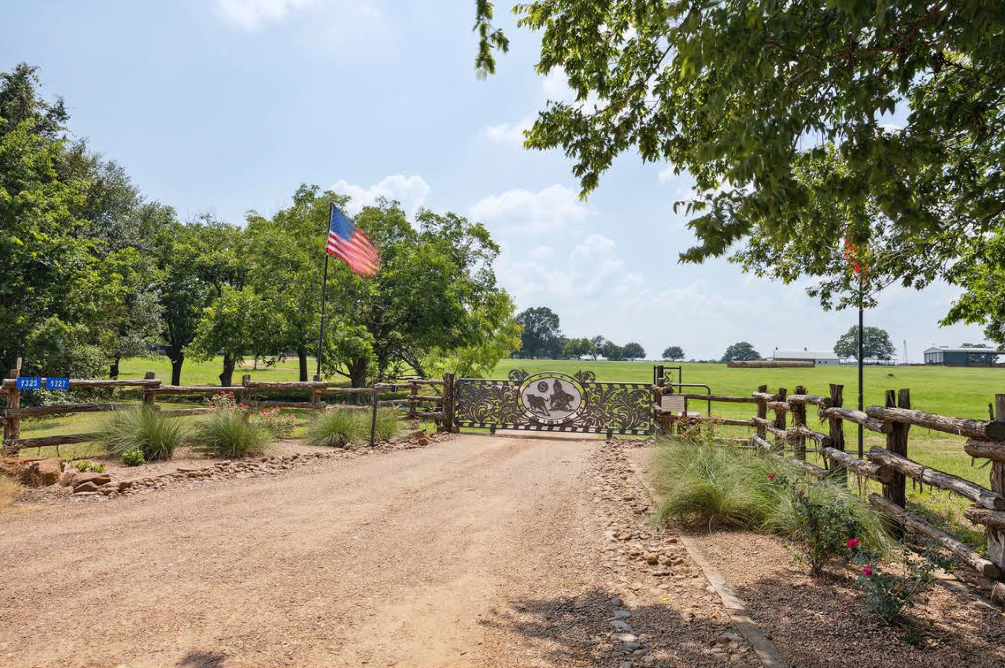 1325 Stalmach Road New Ulm, TX 78950 - Photo 10 of 50 Gorgeous, custom cutting horse entrance gate on an electric sliding rail.
