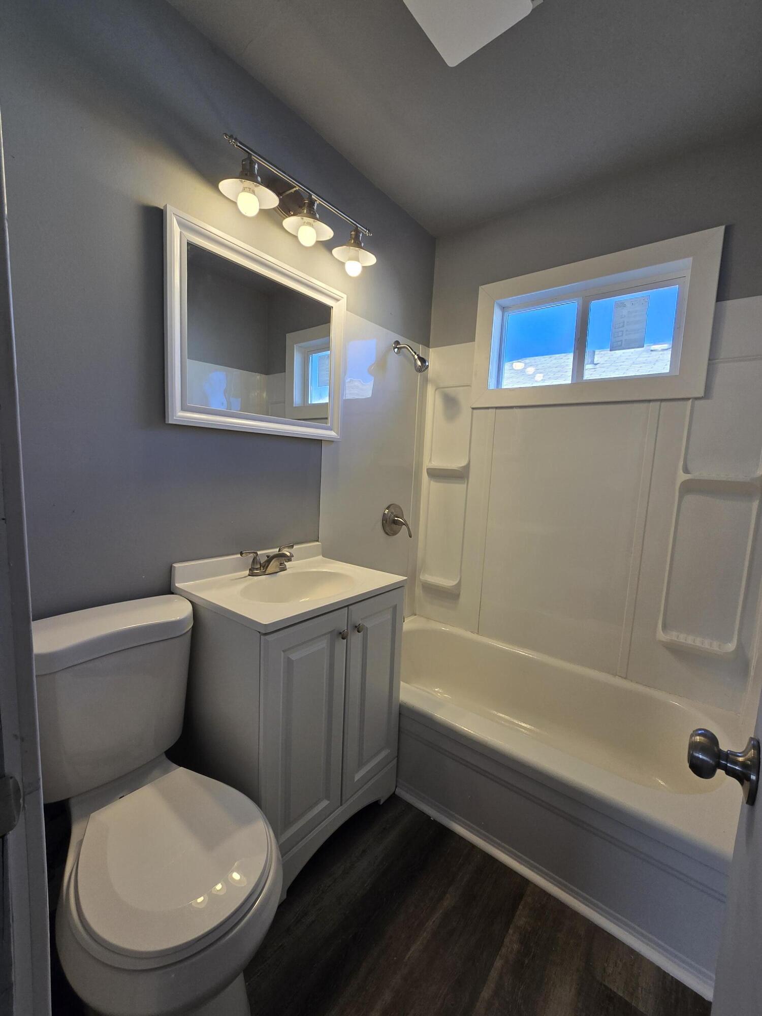 1622 Ohio Street Gary, IN 46407 - Photo 6 of 17 a bathroom with a toilet a sink and bathtub