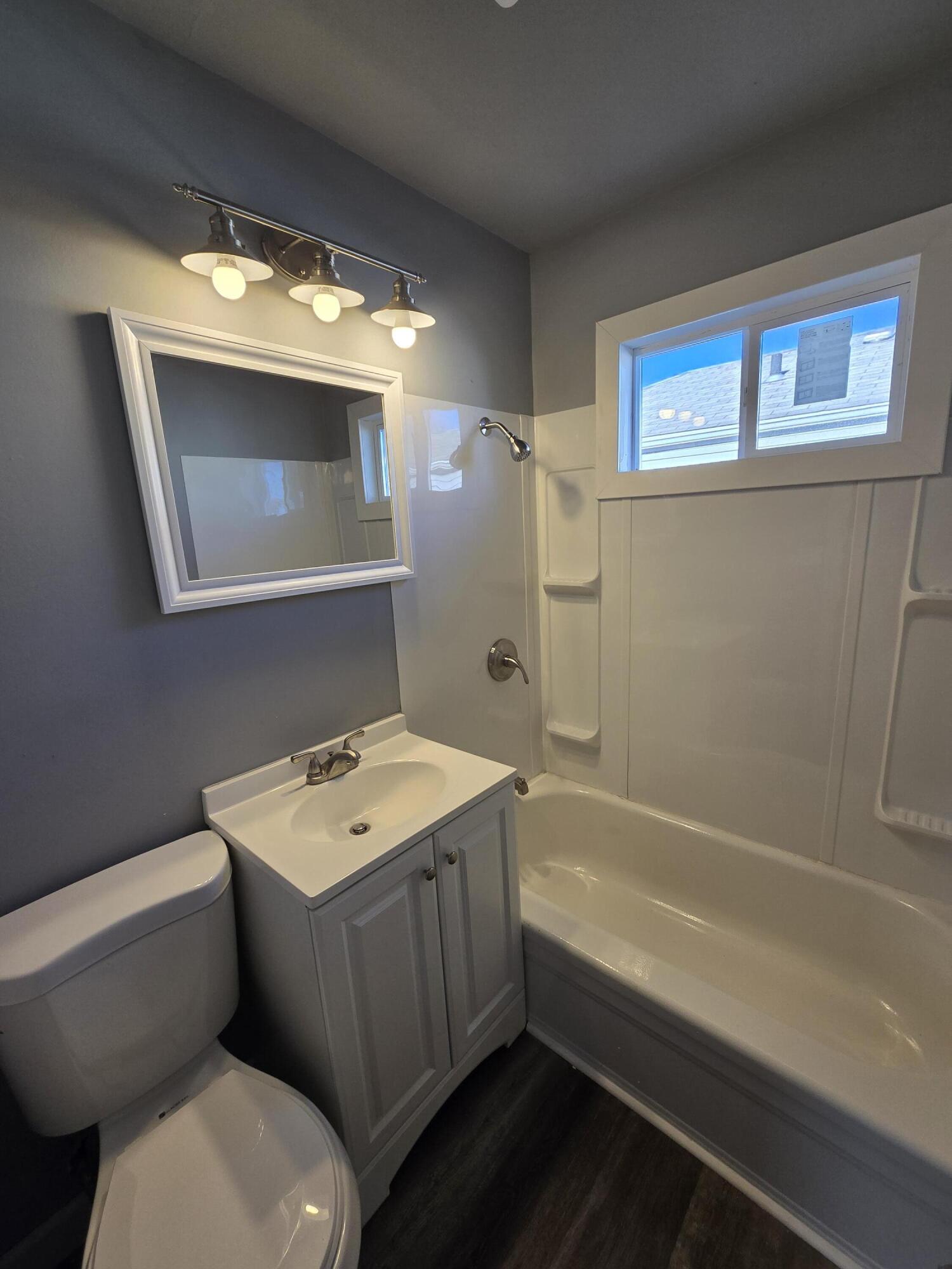 1622 Ohio Street Gary, IN 46407 - Photo 7 of 17 a bathroom with a toilet sink and mirror