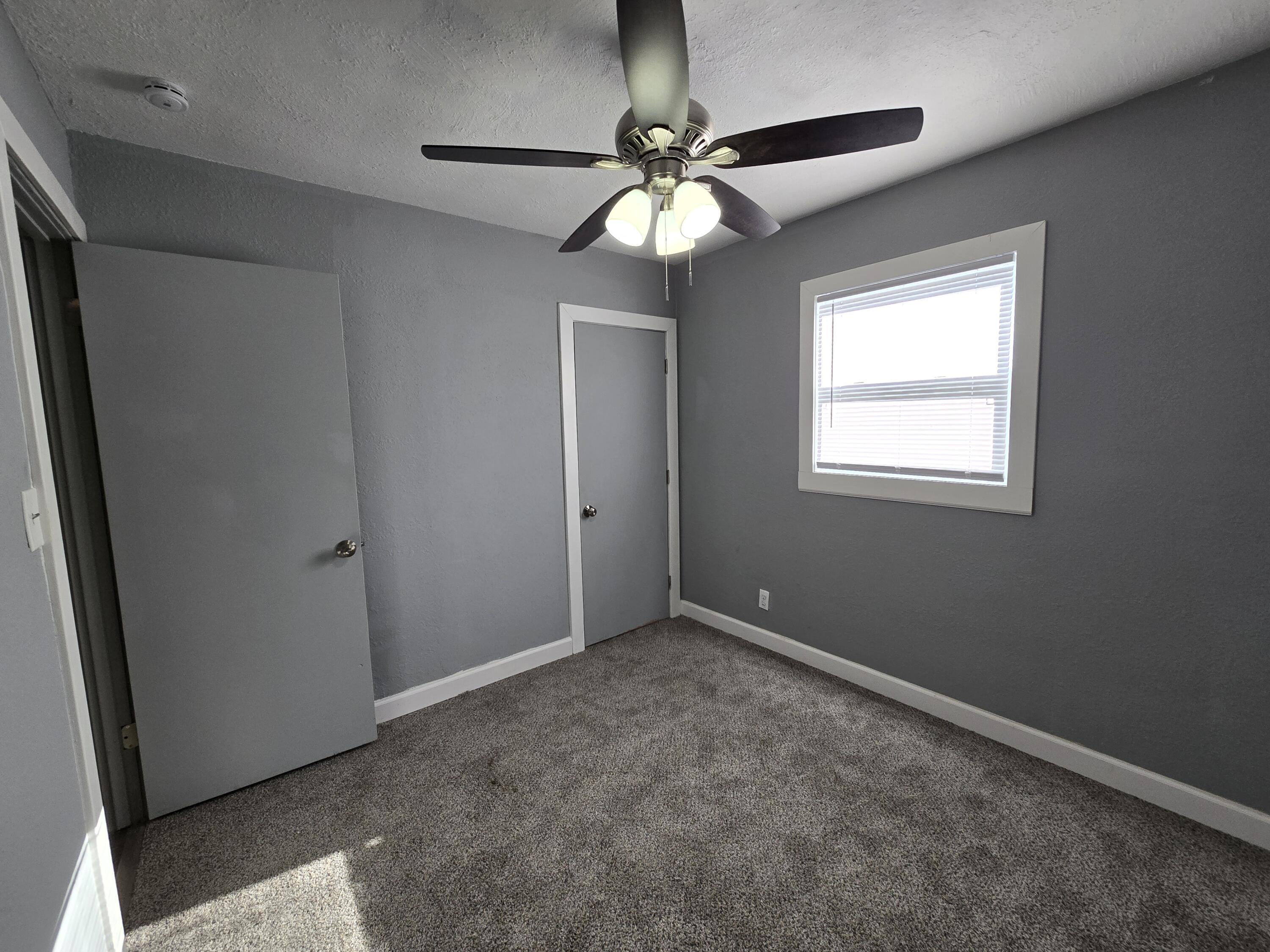 1622 Ohio Street Gary, IN 46407 - Photo 8 of 17 a view of an empty room with a window