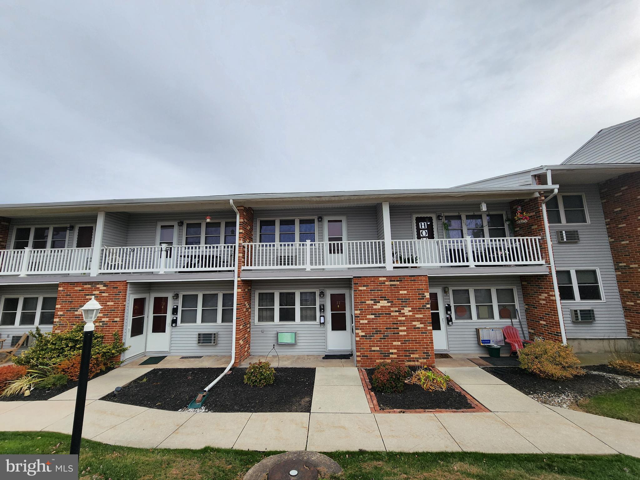 a front view of residential houses with yard