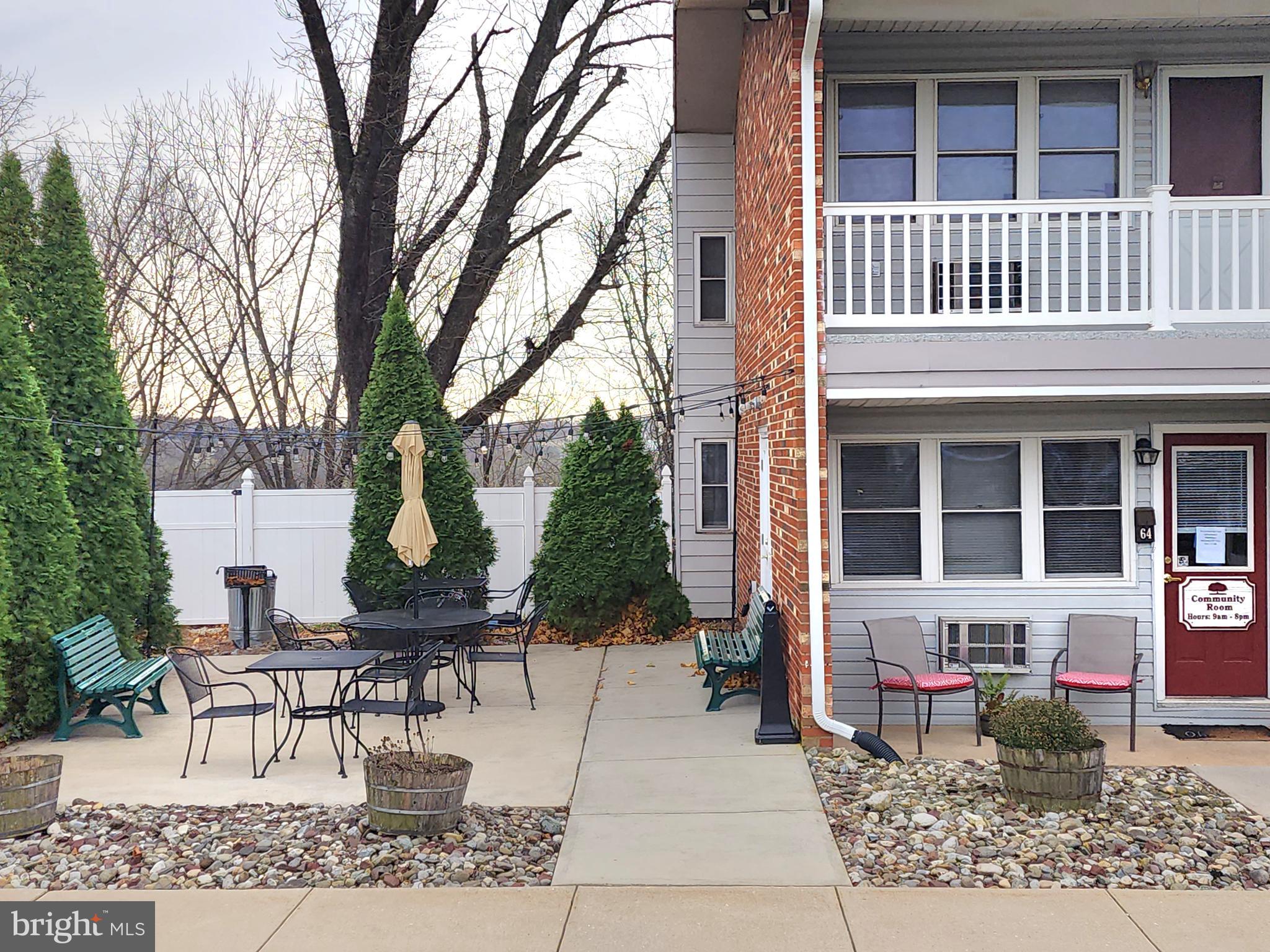 76 Lark Circle York, PA 17404 - Photo 21 of 28 a view of a building with a bench in patio