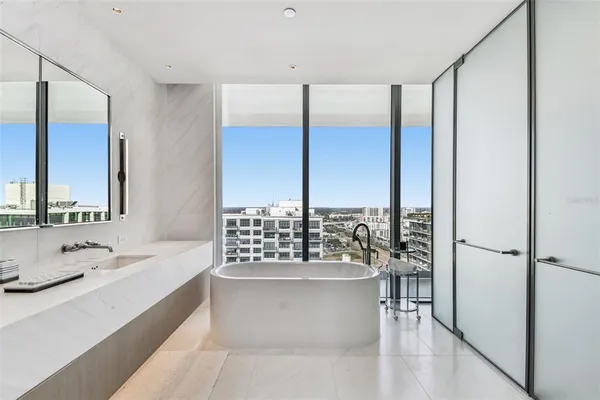 a bathroom with a tub and a sink