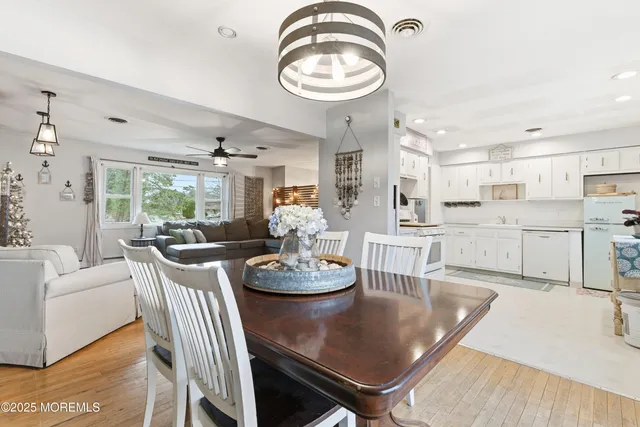 a dining room with furniture a window and kitchen view