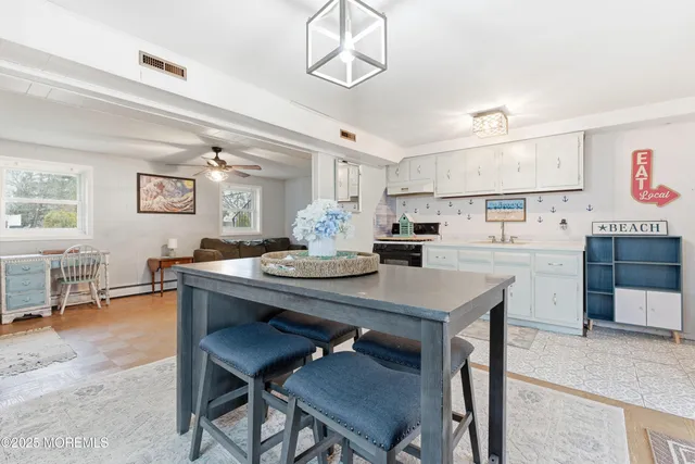 a kitchen with a table and chairs in it