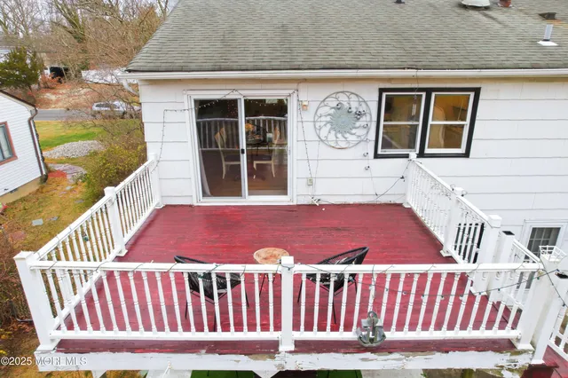 a view of a deck with wooden floor and fence