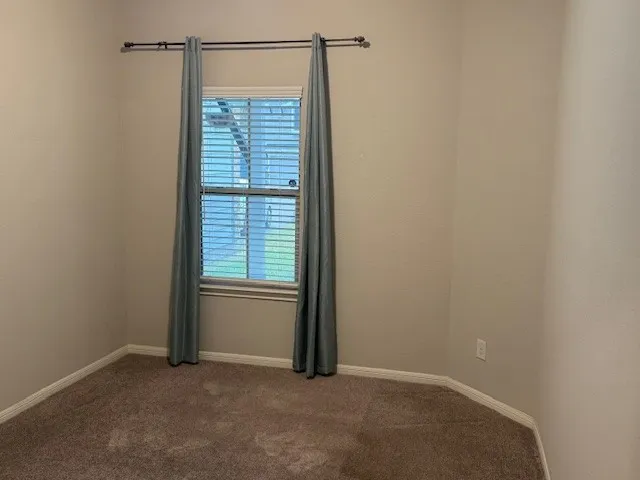 a white toilet sitting next to a bath tub