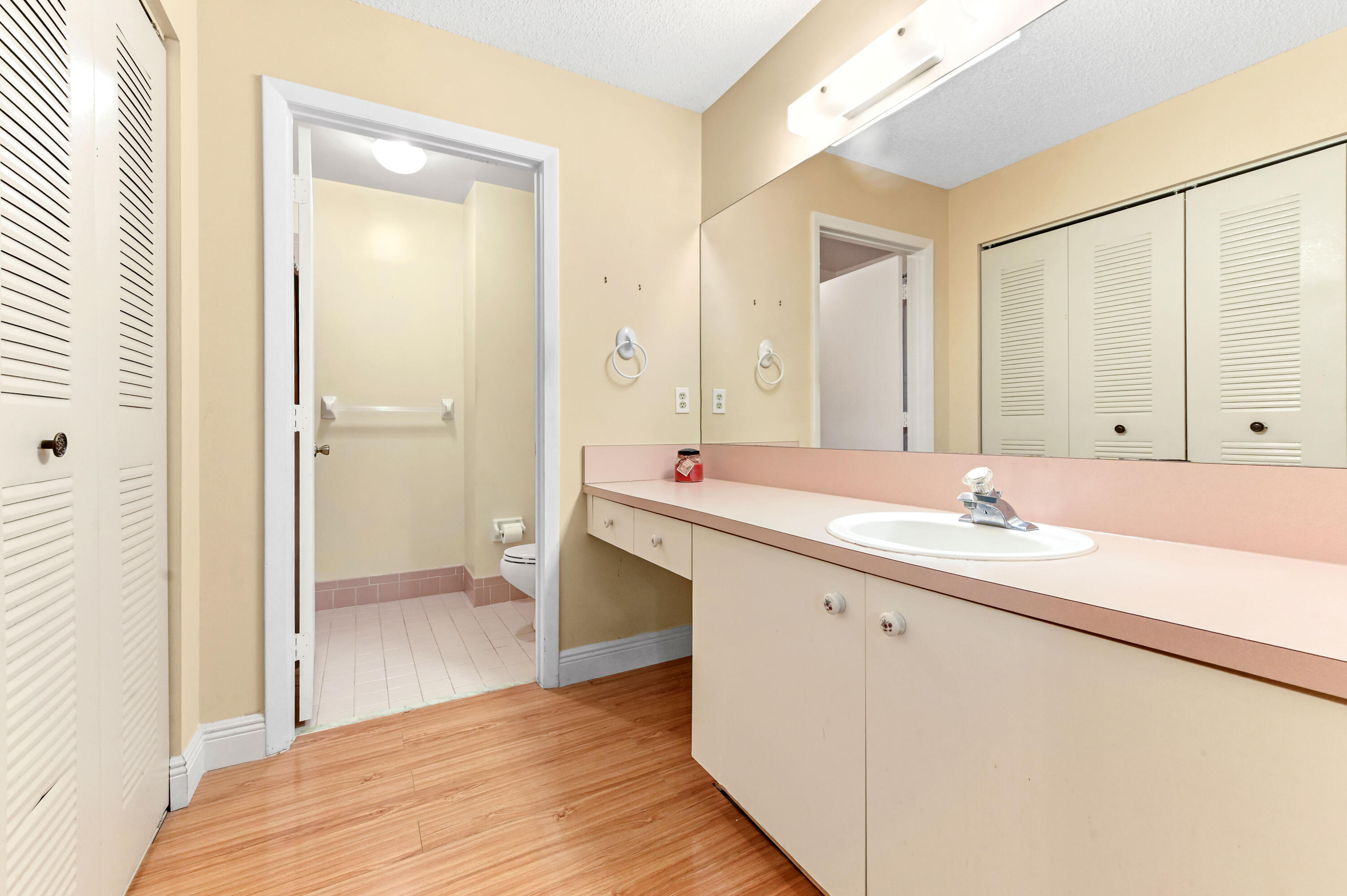 3325 Northwest 79th Way Davie, FL 33024 - Photo 23 of 29 a bathroom with a sink a mirror and a shower