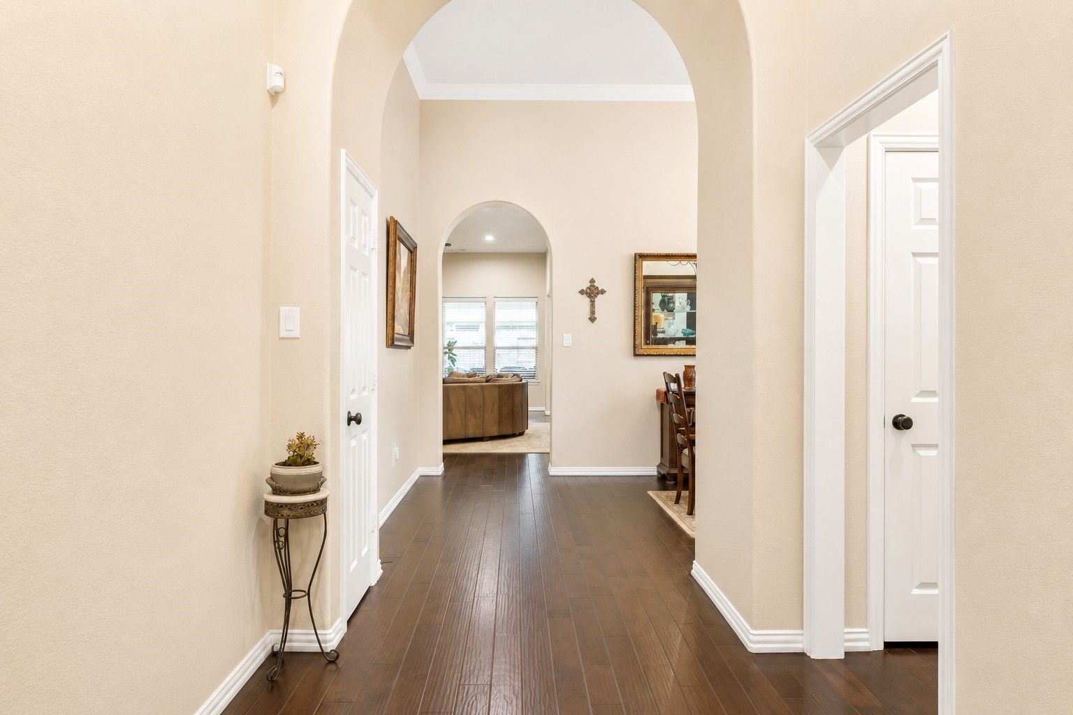 2326 Hamilton Pool Lane Friendswood, TX 77546 - Photo 5 of 49 a view of a hallway with wooden floor and a living room