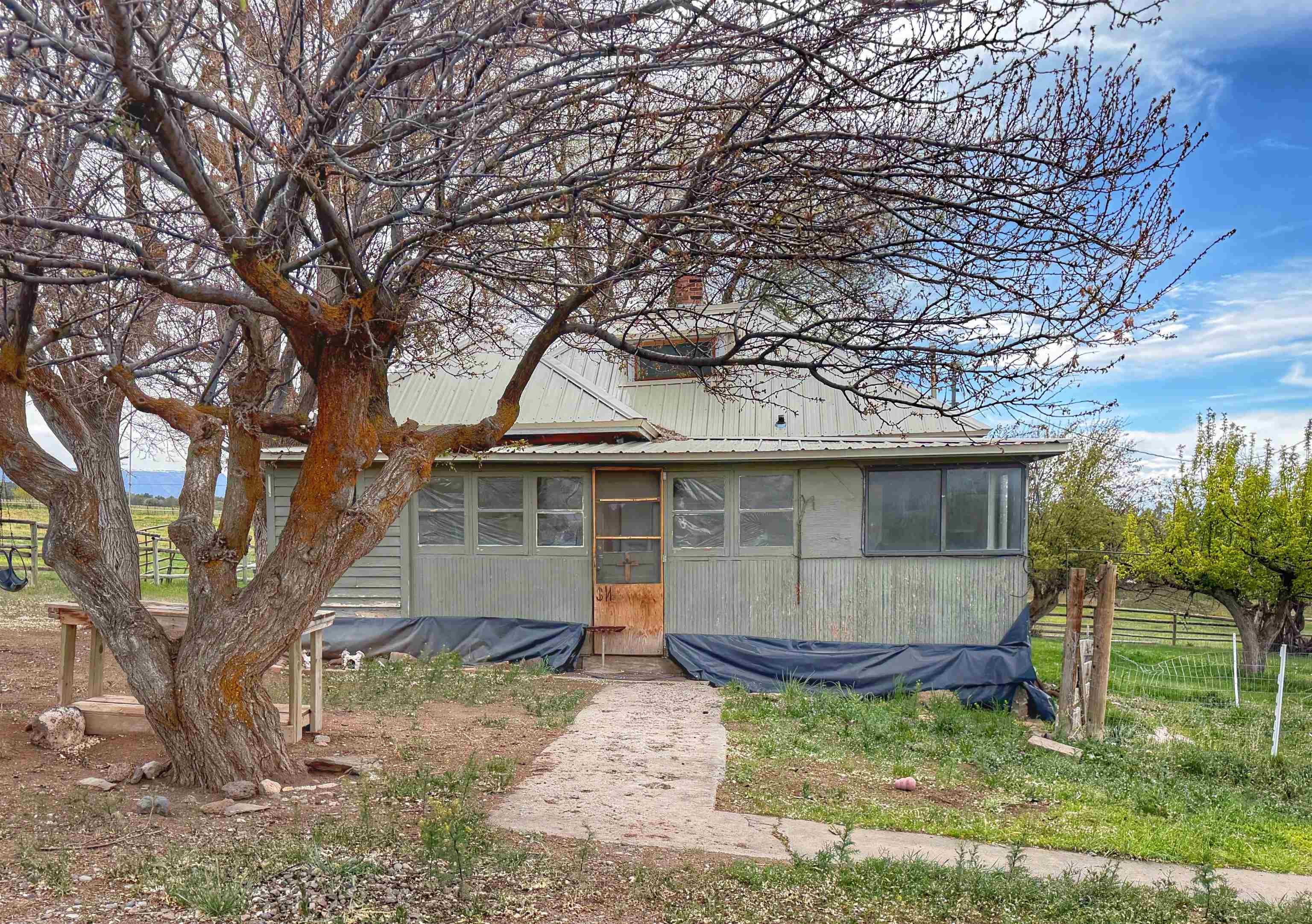 11260 54 7/10 Road Molina, CO 81646 - Photo 29 of 31 a backyard of a house with barbeque oven fire pit table and chairs