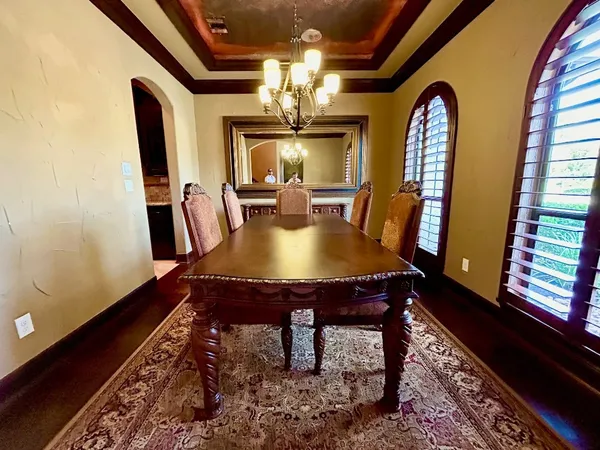 a view of living room kitchen and entryway