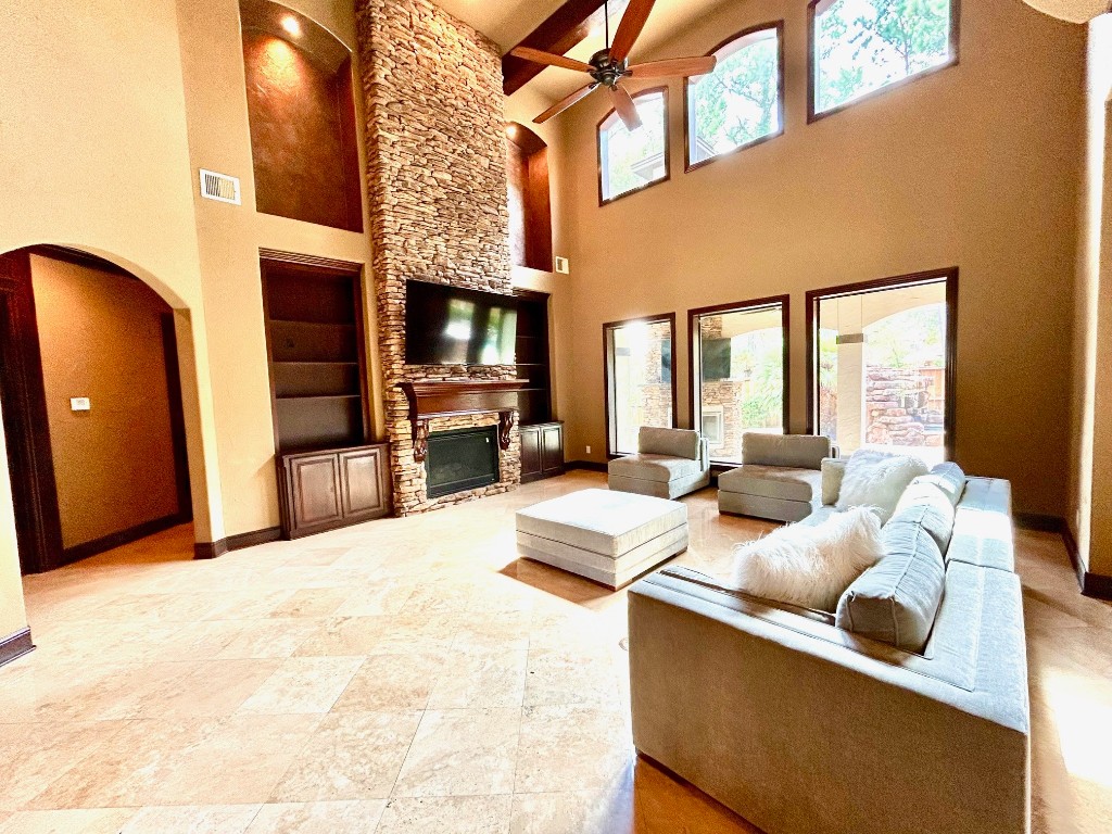 7511 Raes Creek Drive Spring, TX 77389 - Photo 15 of 41 a living room with furniture a flat screen tv and a fireplace