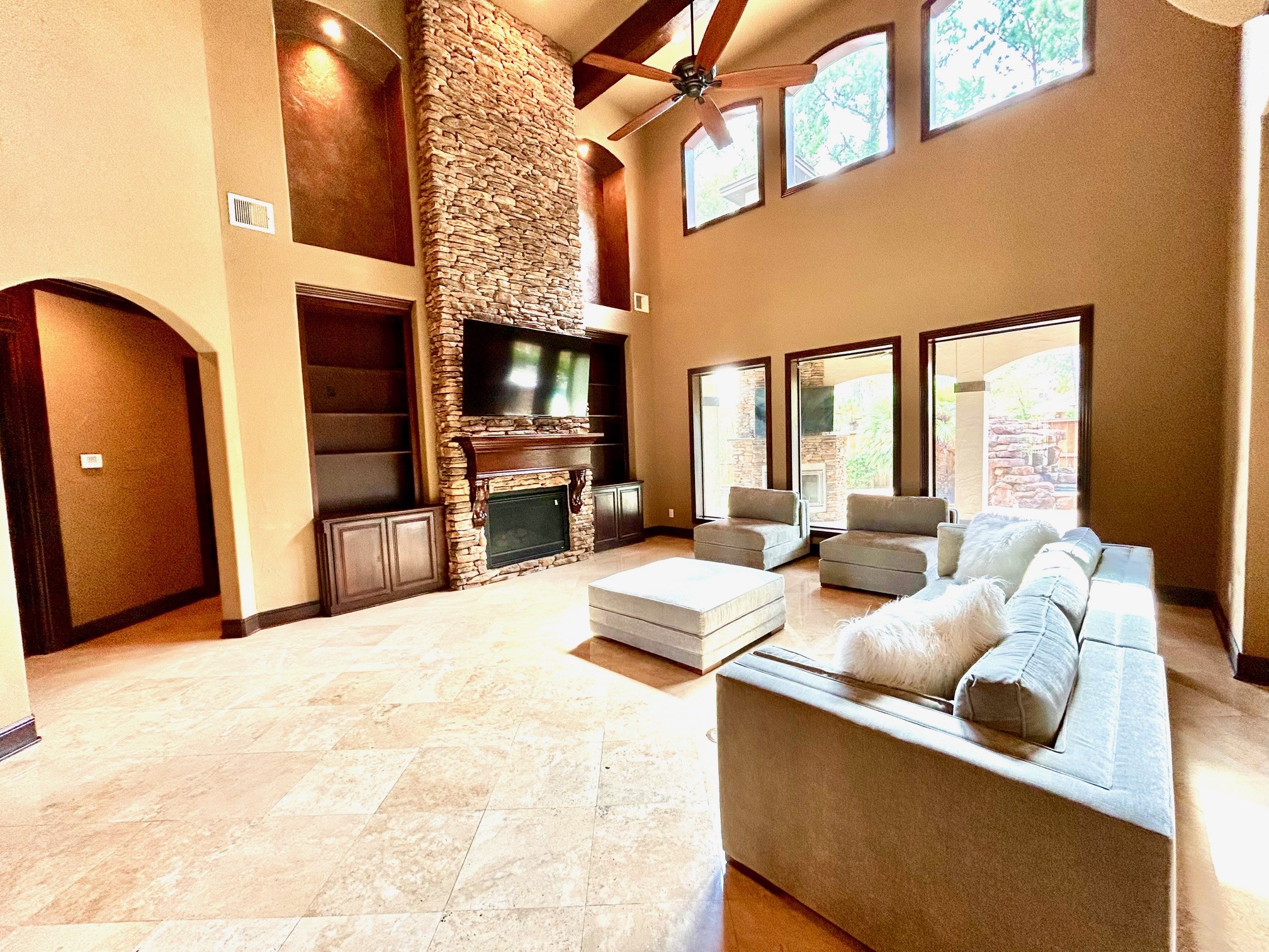 7511 Raes Creek Drive Spring, TX 77389 - Photo 15 of 41 a living room with furniture a flat screen tv and a fireplace