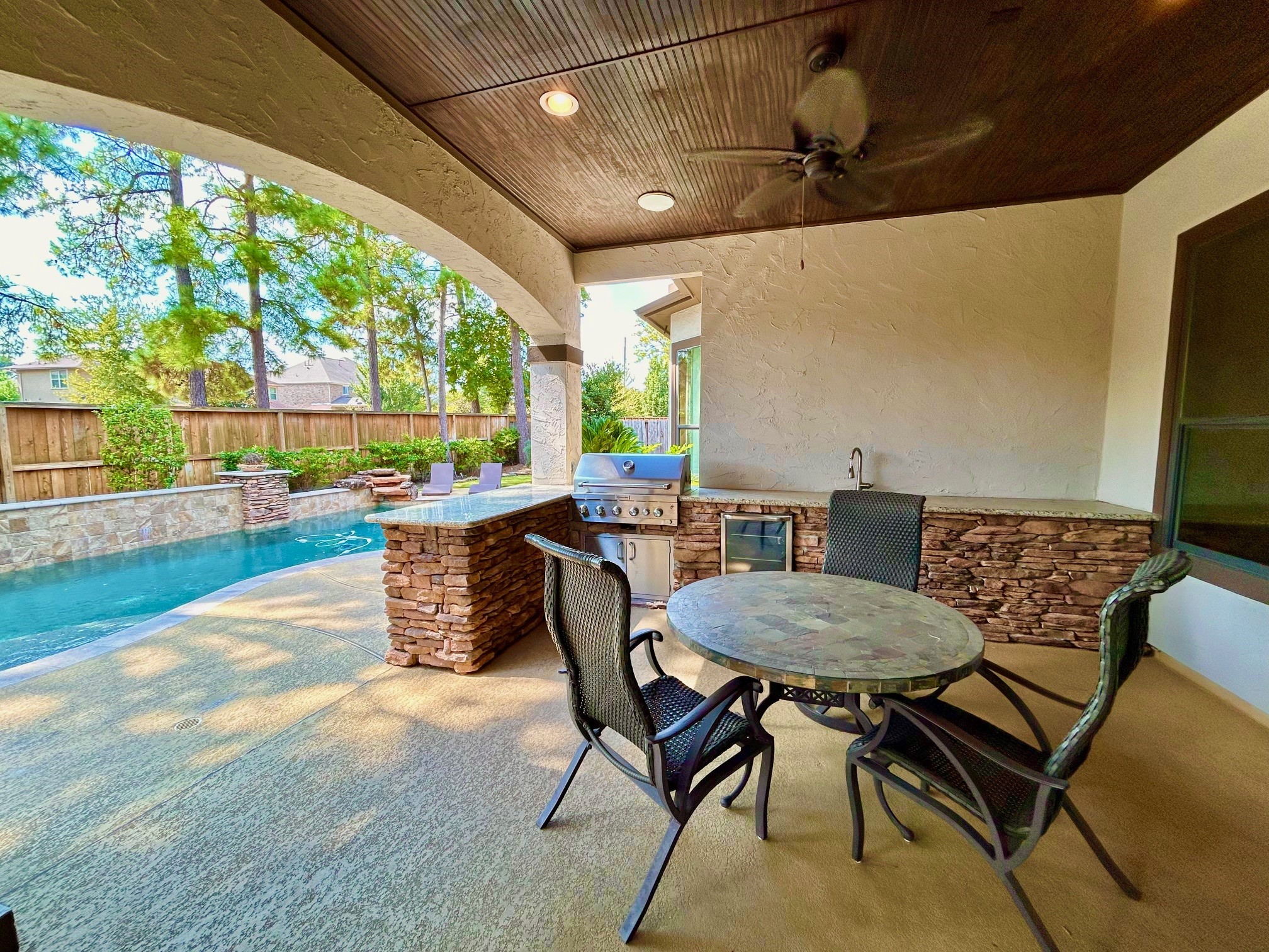 7511 Raes Creek Drive Spring, TX 77389 - Photo 29 of 41 a view of a patio with table and chairs and potted plants