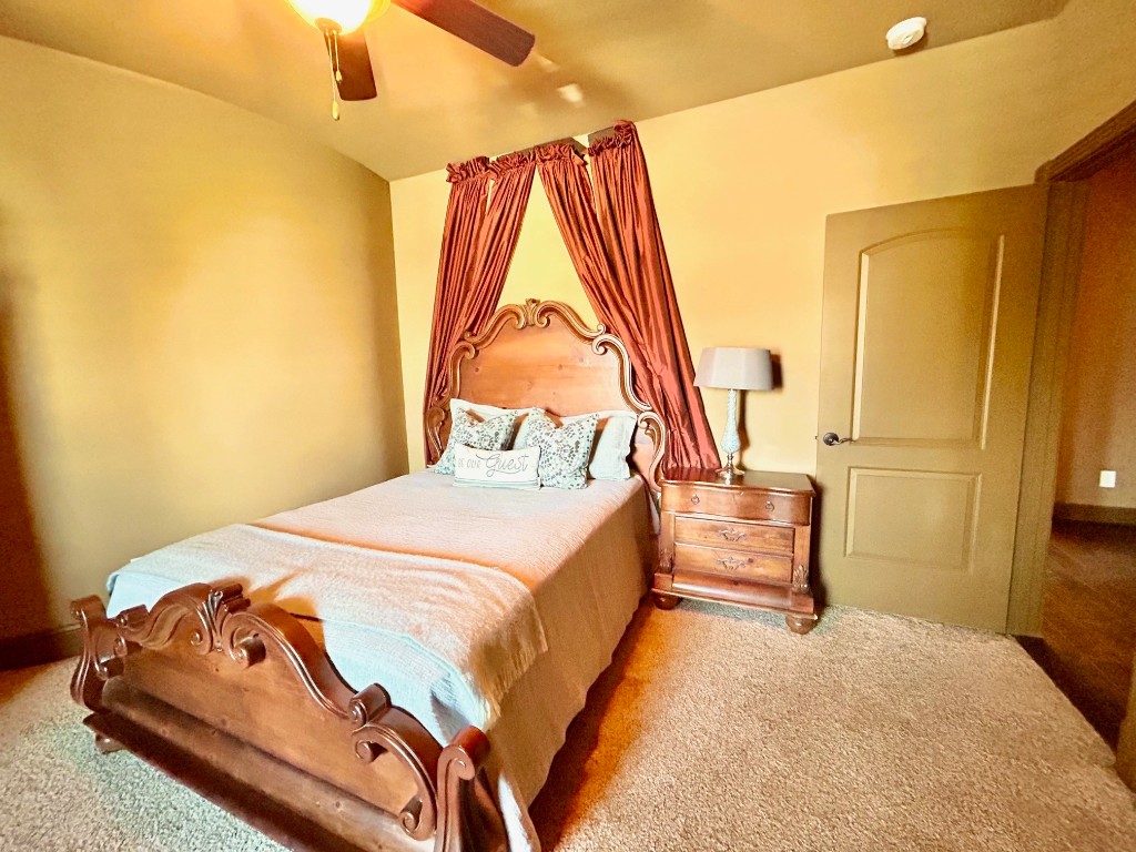 7511 Raes Creek Drive Spring, TX 77389 - Photo 36 of 41 a bedroom with a bed and a painting on the wall