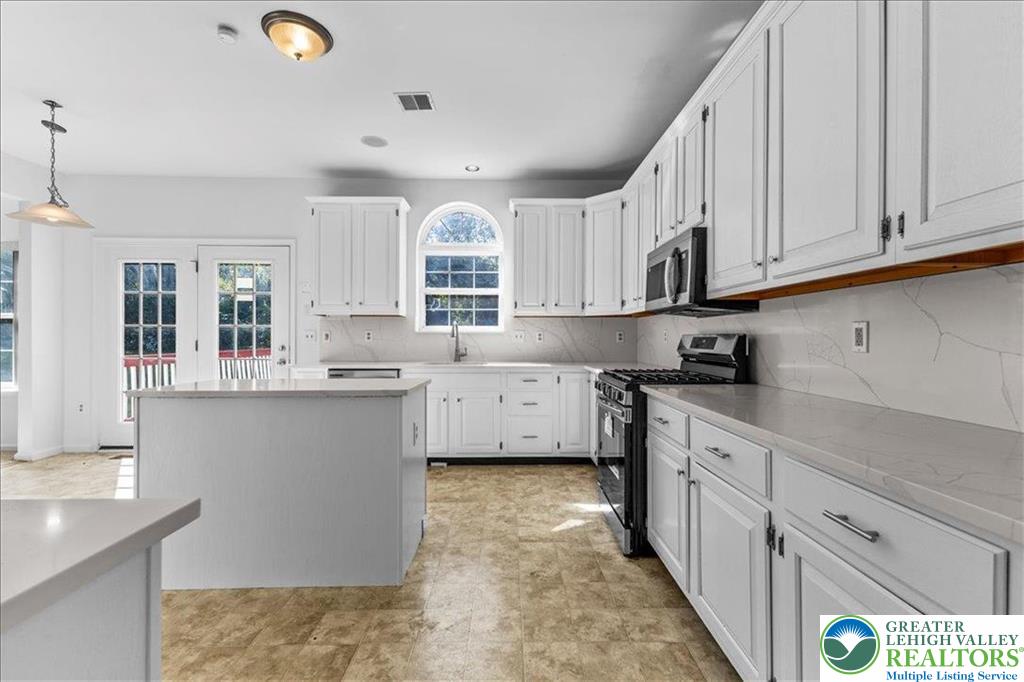 6832 Scenic View Drive Lower Macungie Township, PA 18062 - Photo 11 of 21 a kitchen with cabinets a sink and appliances