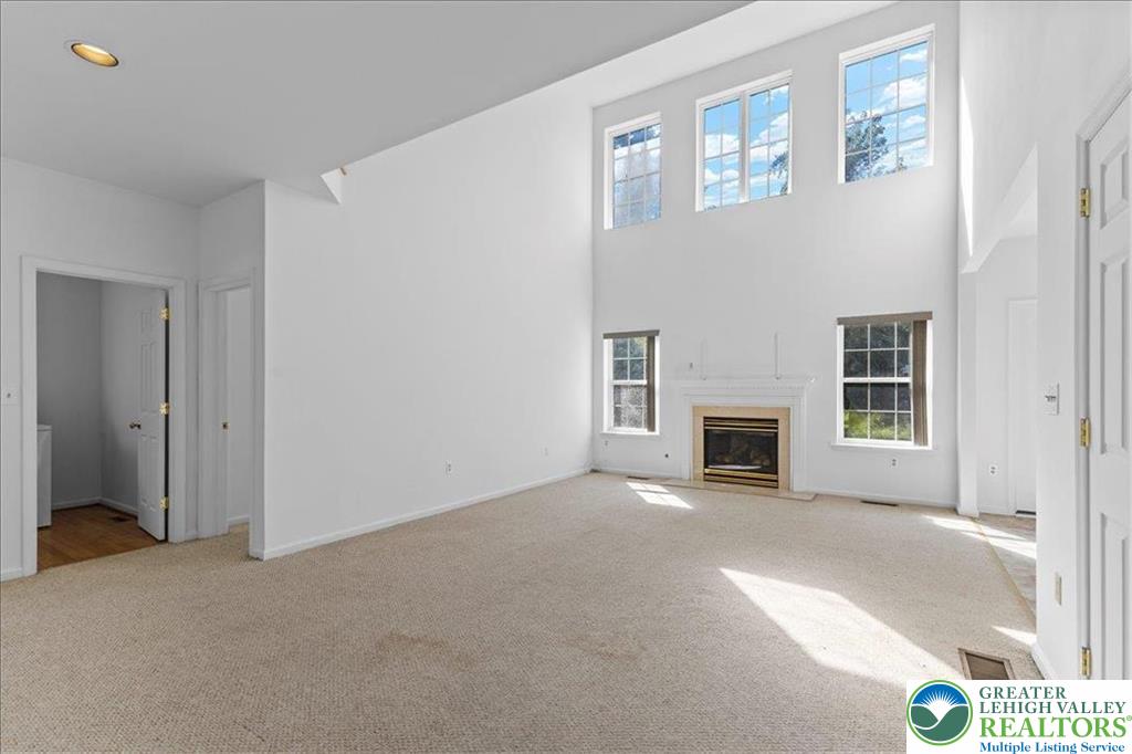 6832 Scenic View Drive Lower Macungie Township, PA 18062 - Photo 13 of 21 a view of a livingroom with an empty space and a fireplace