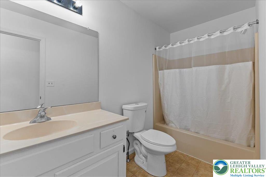 6832 Scenic View Drive Lower Macungie Township, PA 18062 - Photo 17 of 21 a bathroom with a sink a toilet and shower