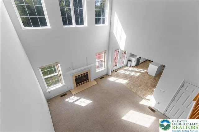 a view of living room with furniture and fireplace