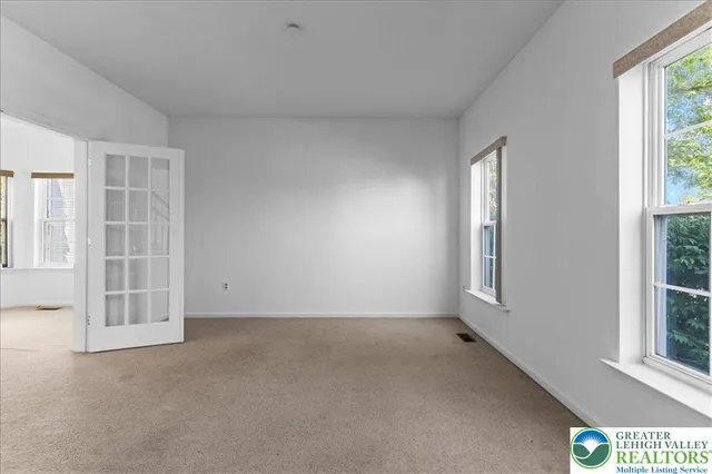 an empty room with windows