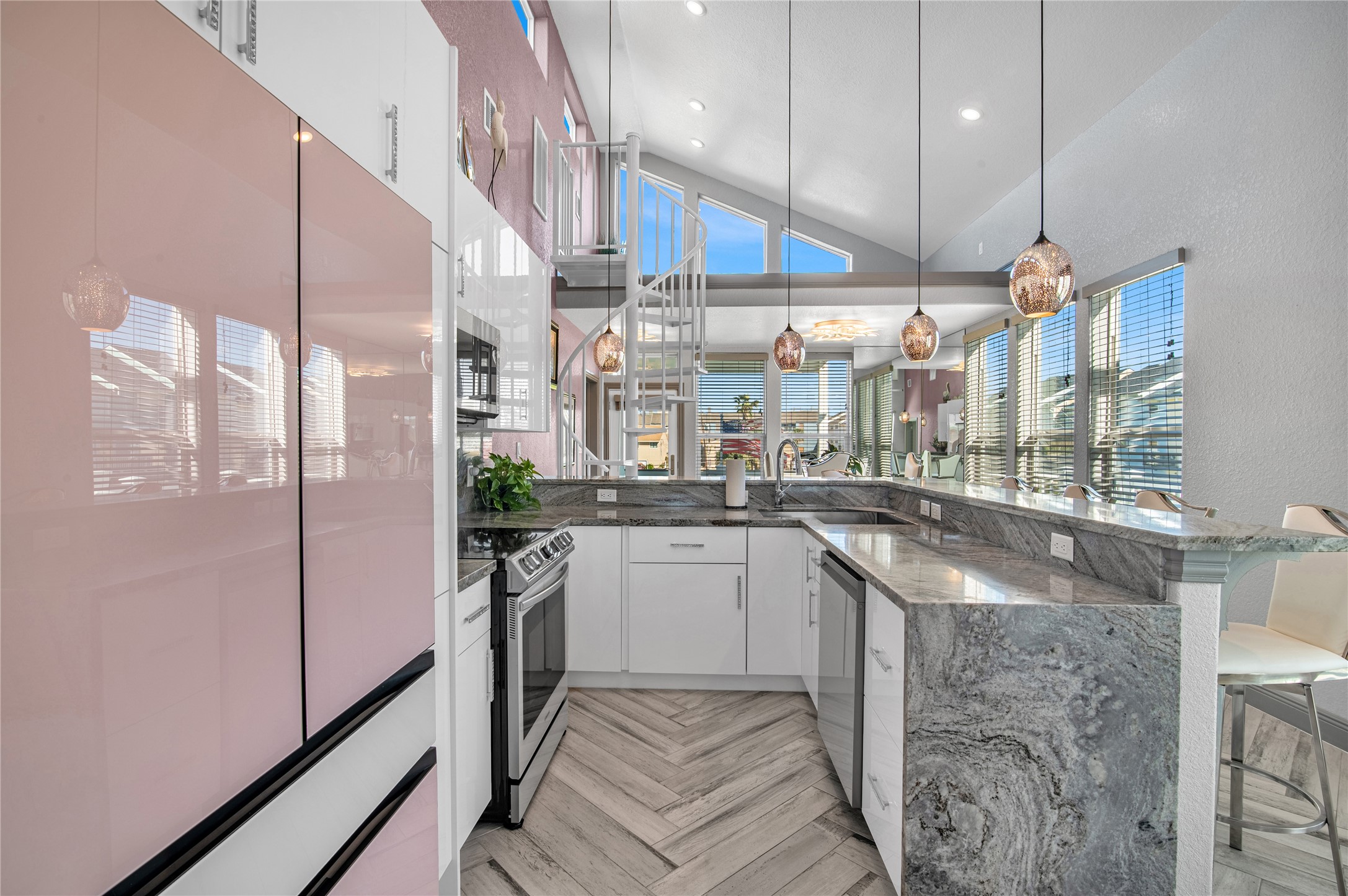 3709 Rice Street Galveston, TX 77554 - Photo 11 of 46 a kitchen with a sink a counter top space stainless steel appliances and cabinets
