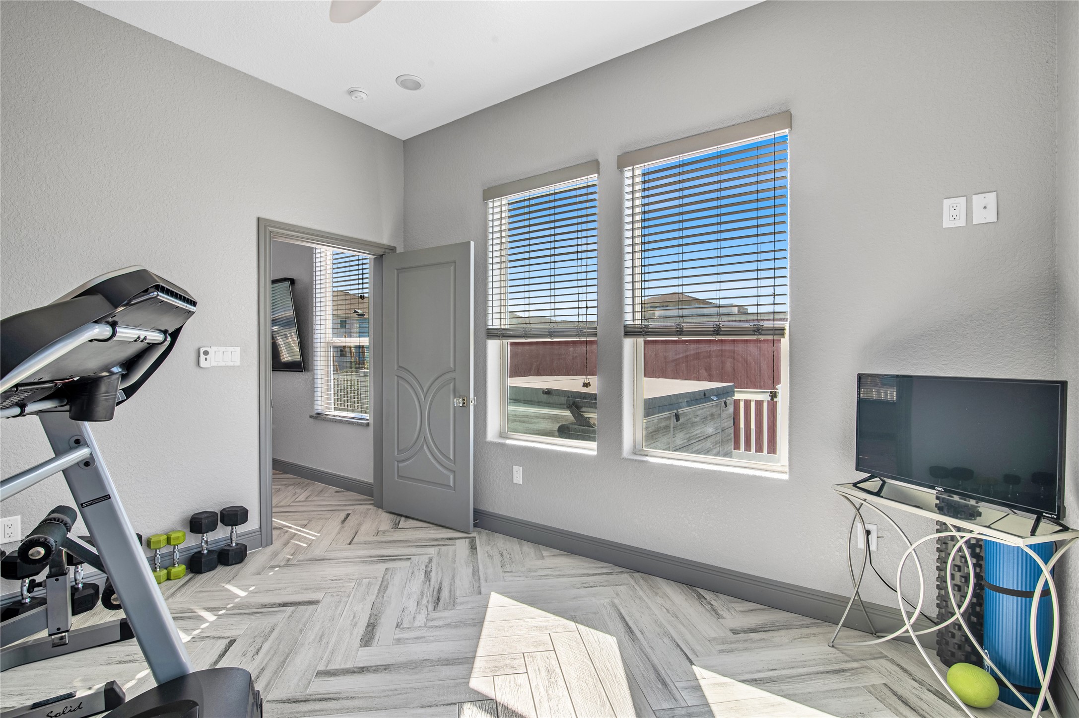 3709 Rice Street Galveston, TX 77554 - Photo 20 of 46 a living room with furniture a flat screen tv and a window
