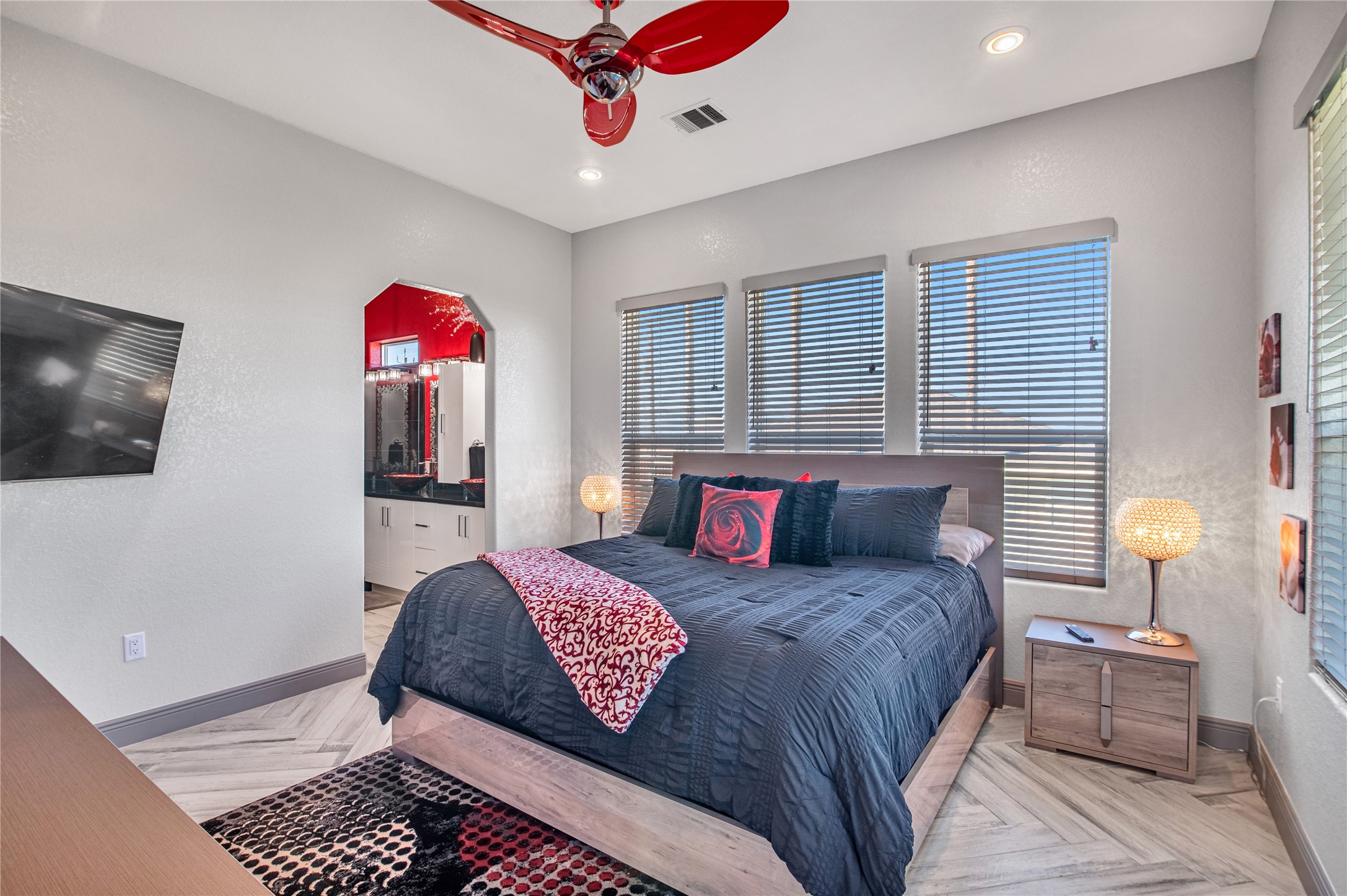 3709 Rice Street Galveston, TX 77554 - Photo 23 of 46 a bedroom with a bed and a chandelier