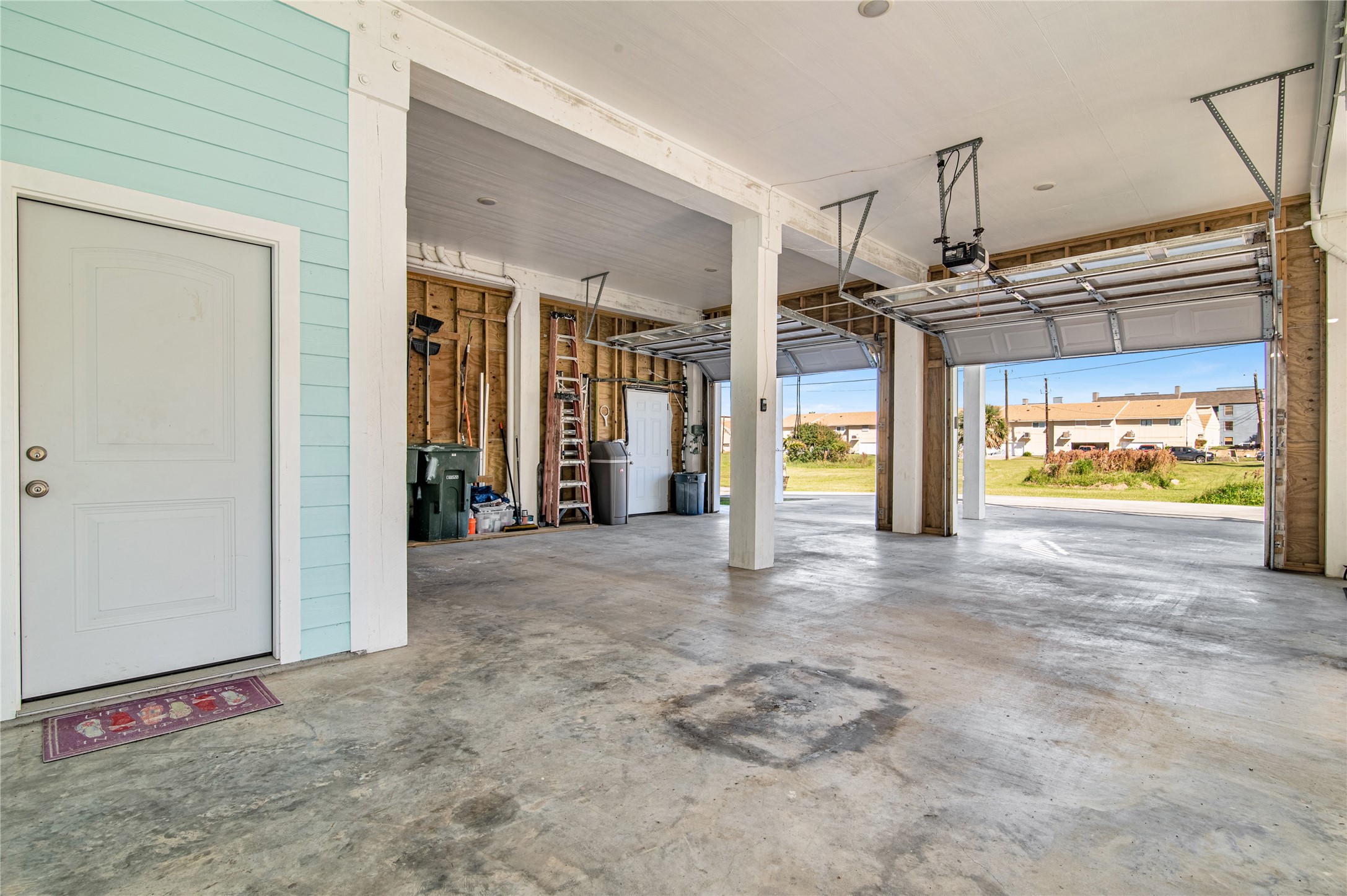 3709 Rice Street Galveston, TX 77554 - Photo 43 of 46 a view of a hallway with wooden floor and a window