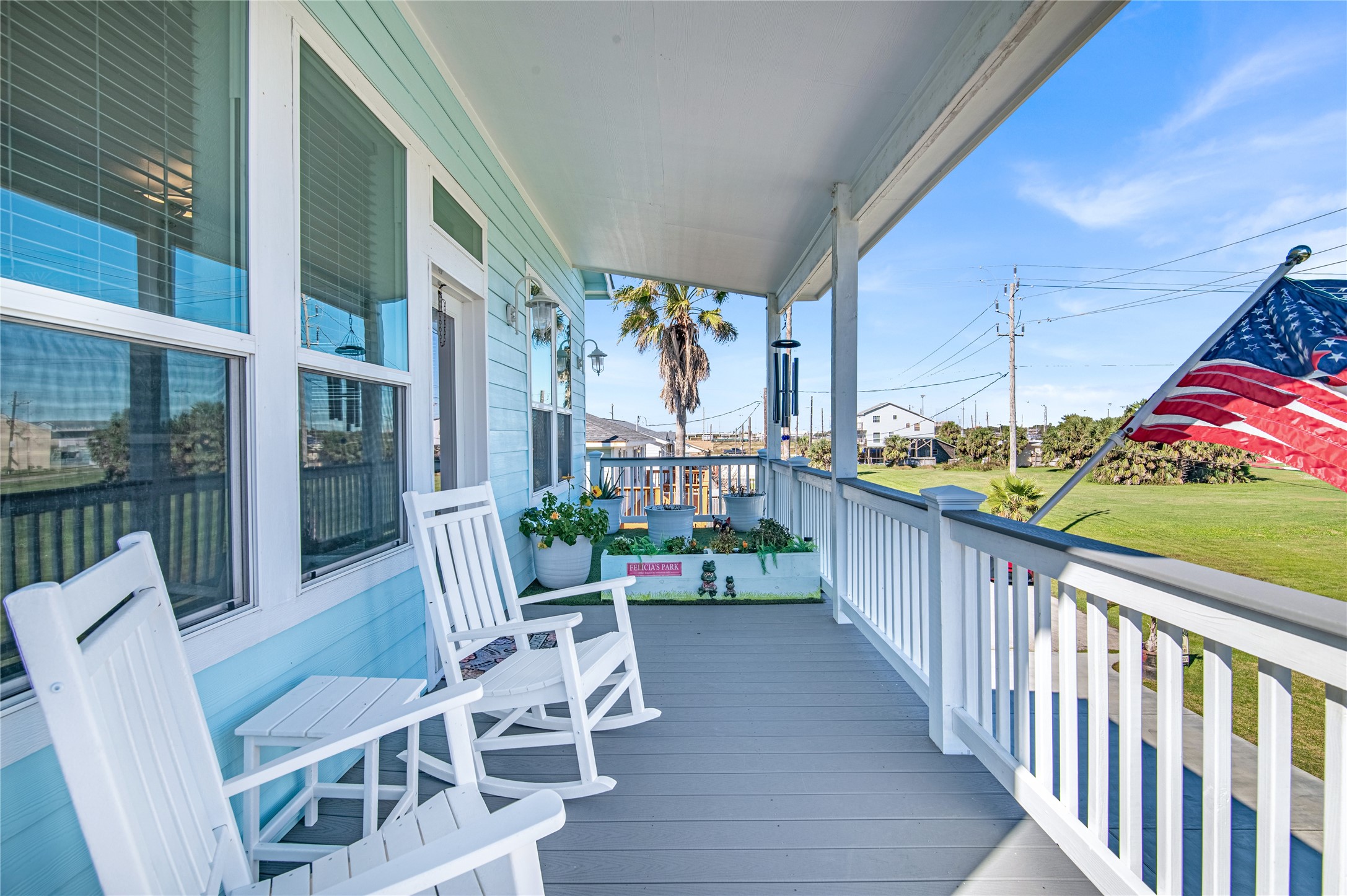 3709 Rice Street Galveston, TX 77554 - Photo 5 of 46 a view of a chairs and table in patio with wooden fence