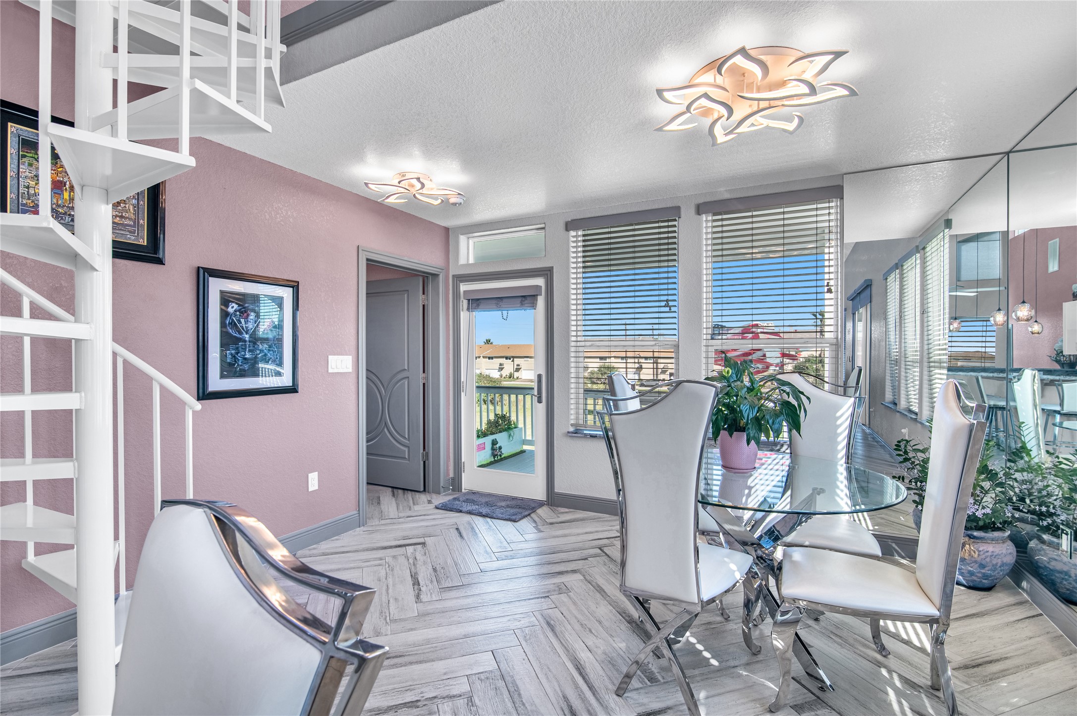 3709 Rice Street Galveston, TX 77554 - Photo 7 of 46 a view of a dining room with furniture and a potted plant
