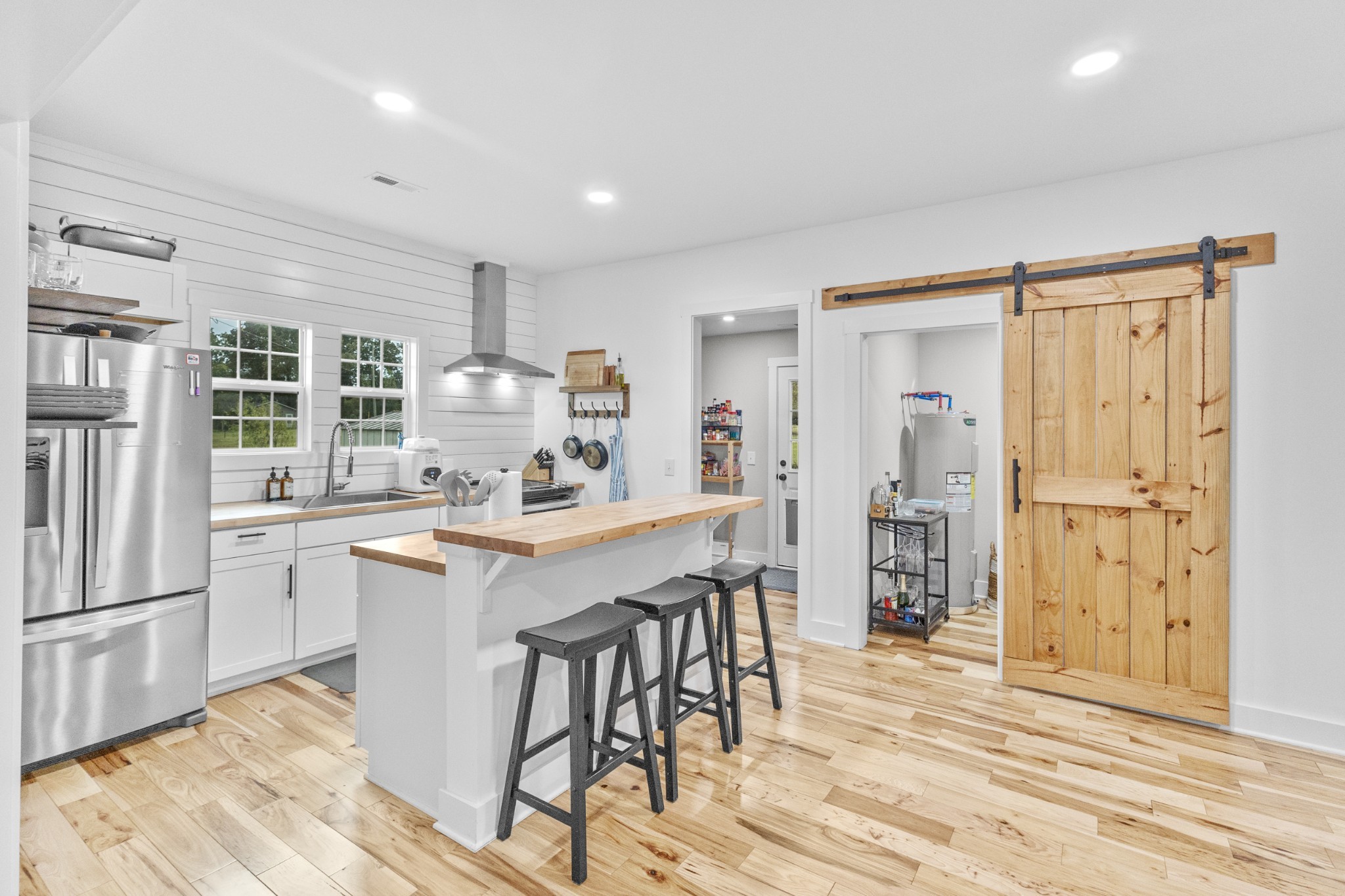 607 Old Columbia Road Unionville, TN 37180 - Photo 16 of 46 a kitchen with stainless steel appliances kitchen island granite countertop a refrigerator and cabinets
