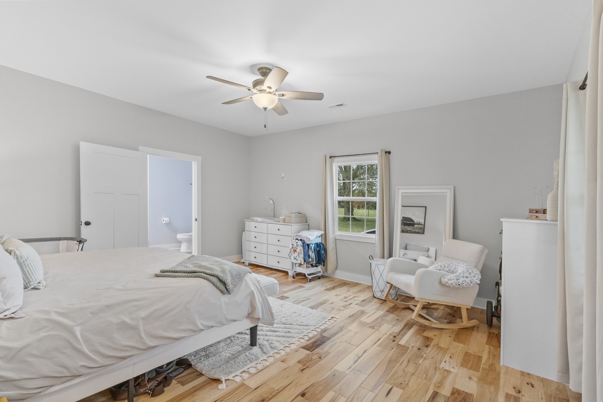 607 Old Columbia Road Unionville, TN 37180 - Photo 23 of 46 a bedroom with a bed and wooden floor
