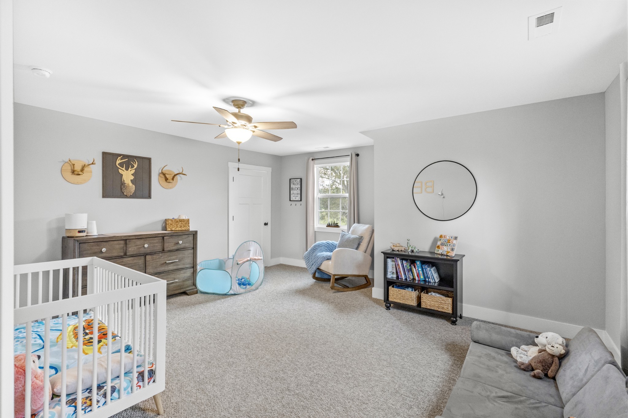 607 Old Columbia Road Unionville, TN 37180 - Photo 32 of 46 a bedroom with furniture and a chandelier fan