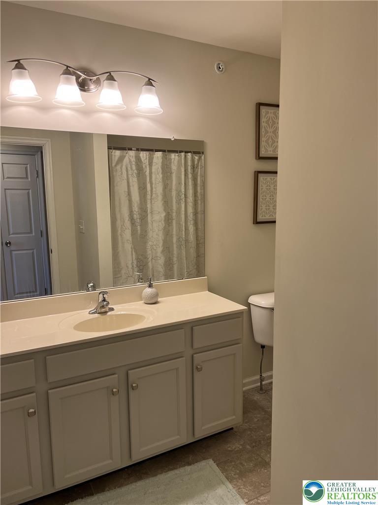 5380 Jutland Road Allentown, PA 18104 - Photo 11 of 27 Functional vanity and shower combination for everyday routines.
