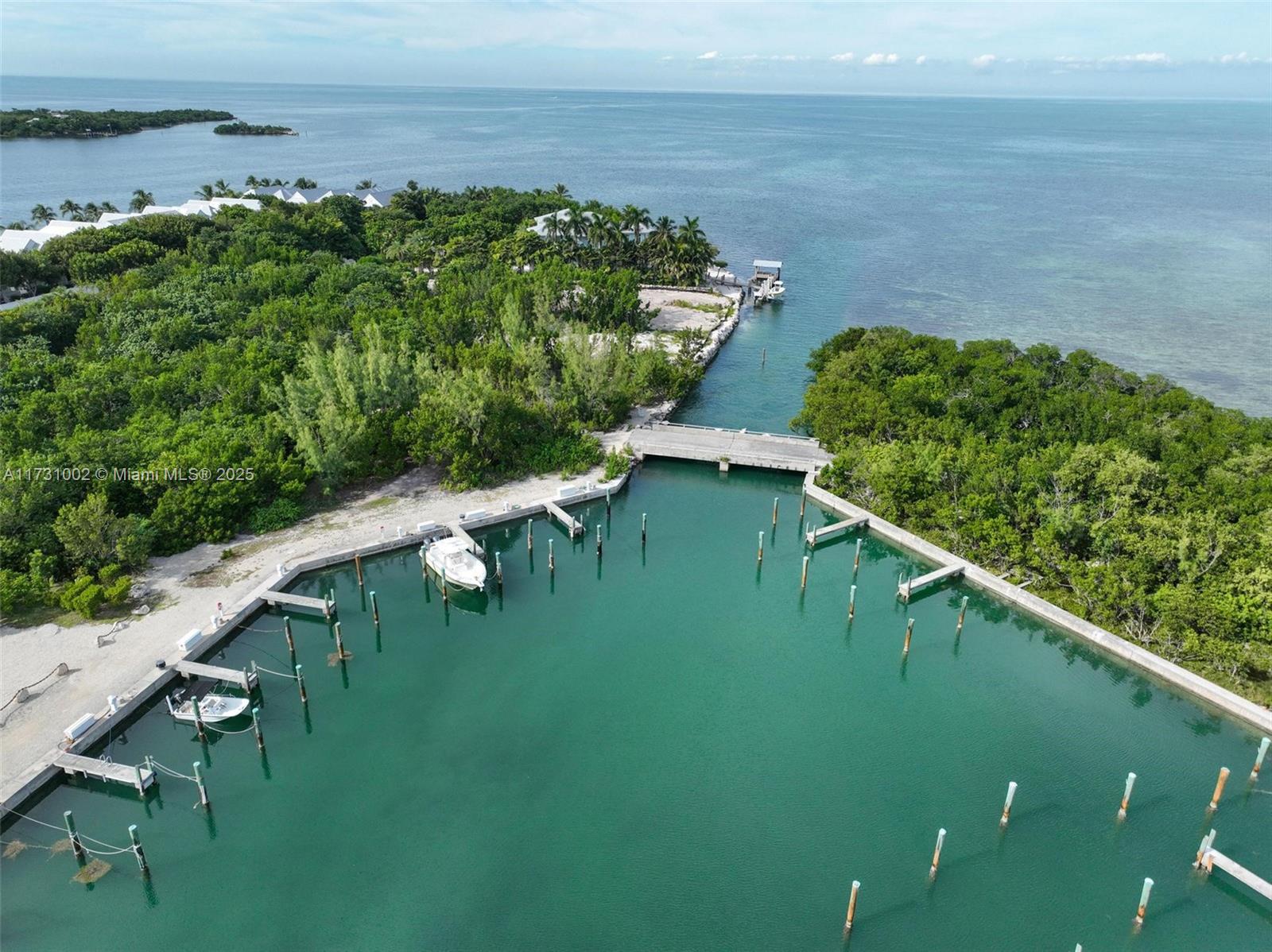 7401 Gulf Of Mexico Boulevard, Unit 4 Marathon, FL 33050 - Photo 19 of 20 a view of a lake with a yard