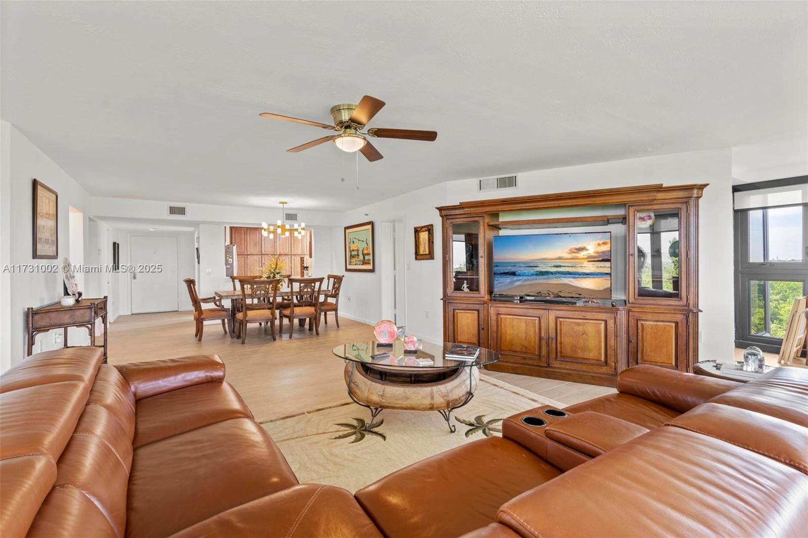 7401 Gulf Of Mexico Boulevard, Unit 4 Marathon, FL 33050 - Photo 7 of 20 a living room with furniture a flat screen tv and a large window