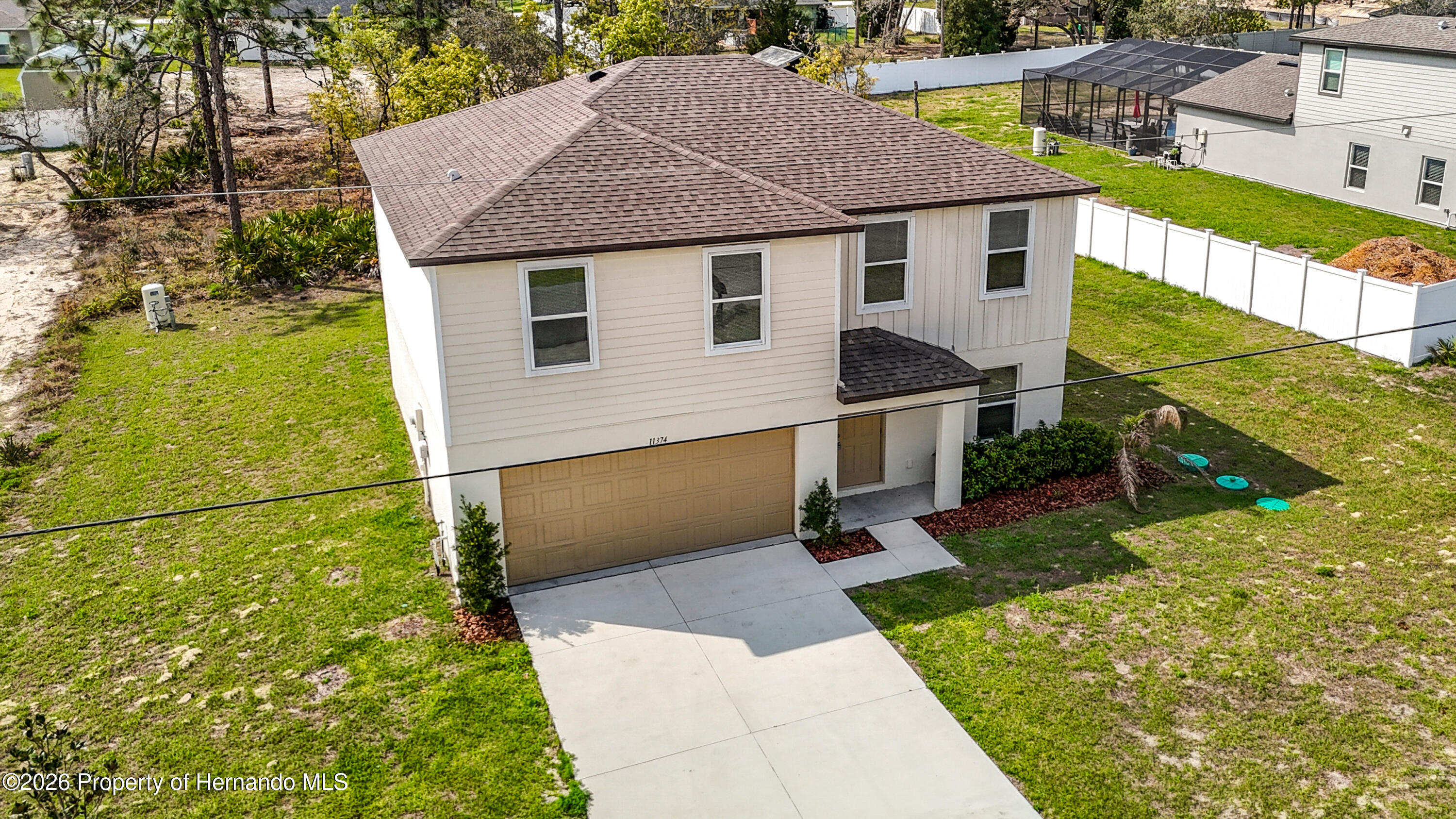 11374 Marcella Avenue Weeki Wachee, FL 34614 - Photo 3 of 70 a view of a back yard of the house