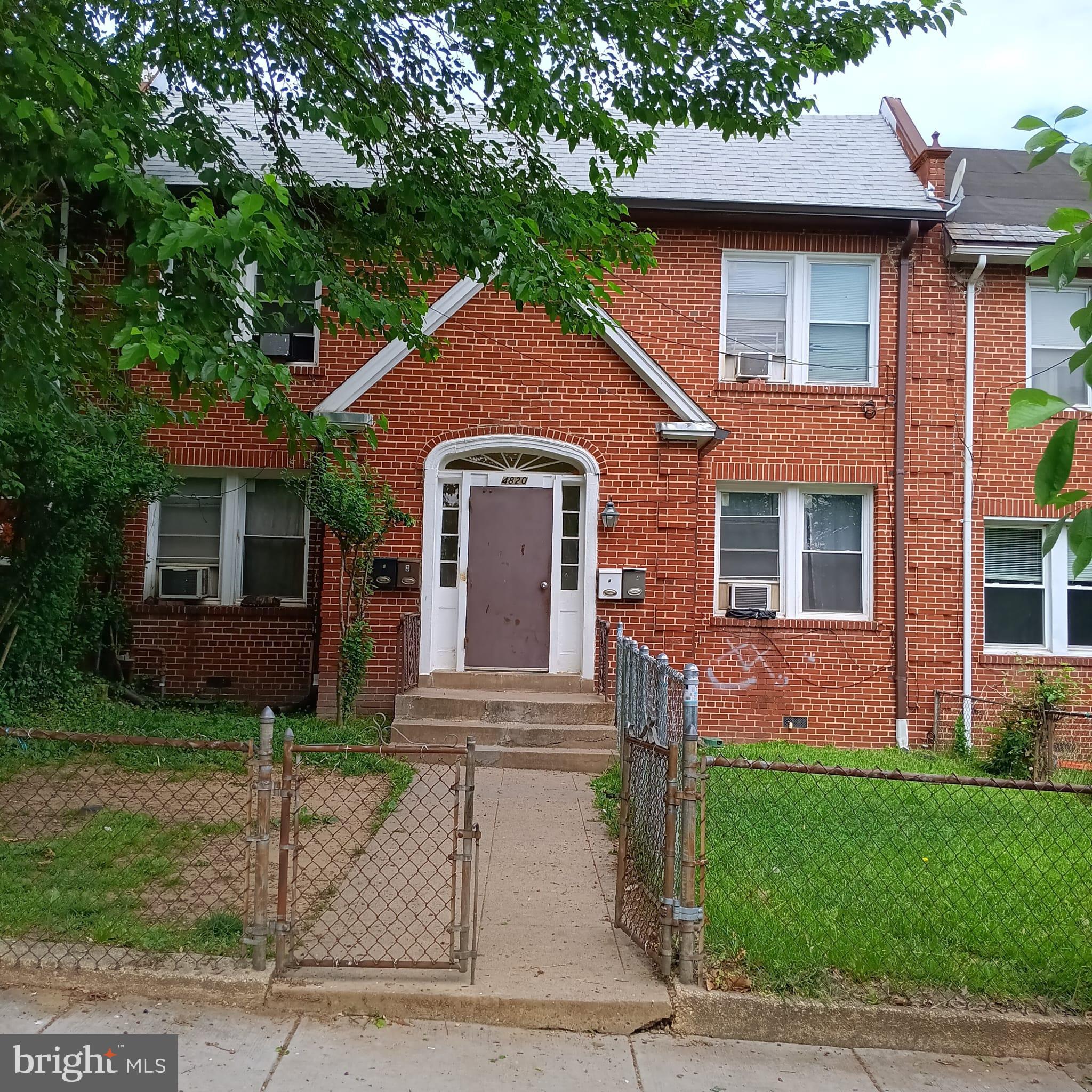 4820 New Hampshire Avenue Northwest Washington, DC 20011 - Photo 1 of 11 a front view of a house with a garden