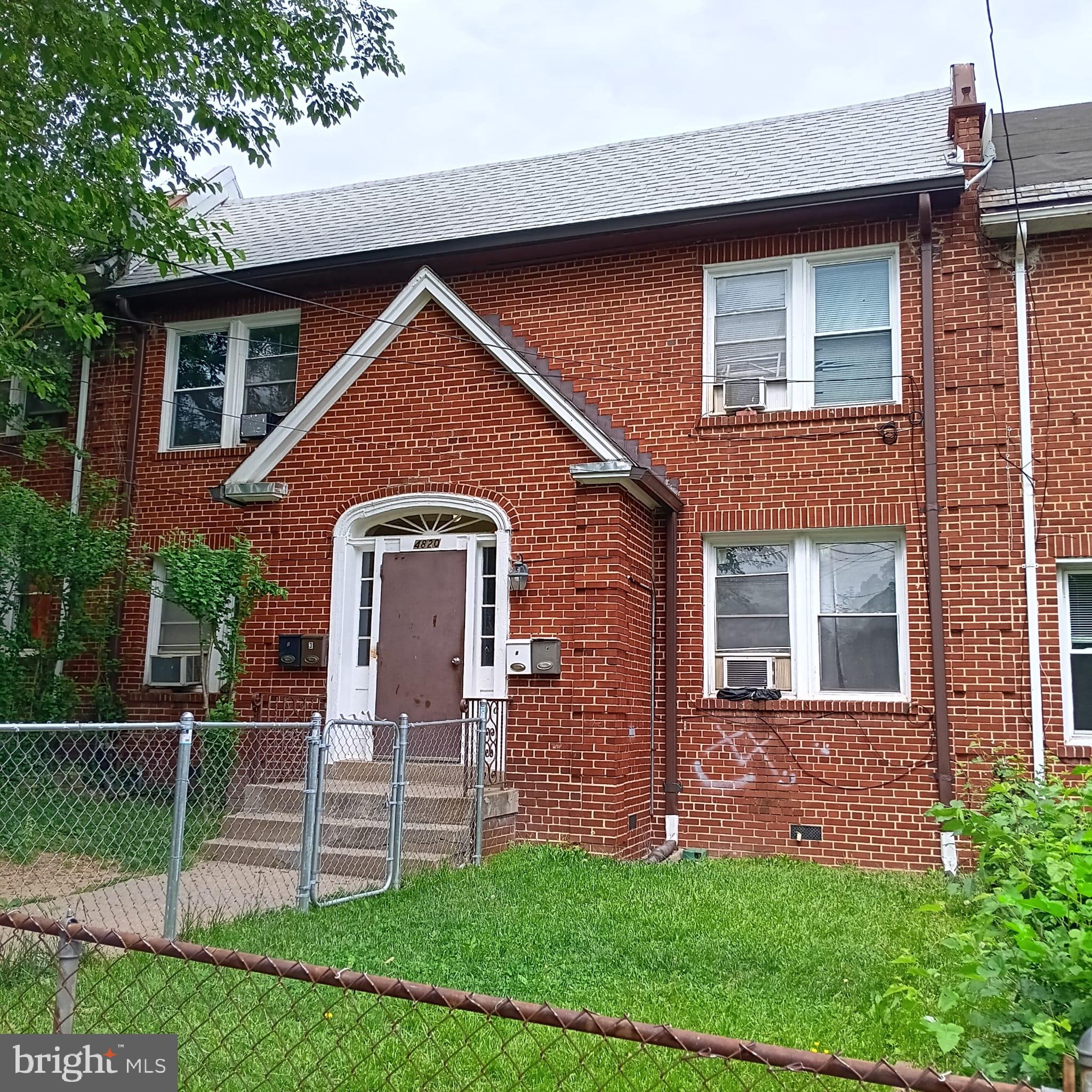 4820 New Hampshire Avenue Northwest Washington, DC 20011 - Photo 2 of 11 a front view of a house with a garden